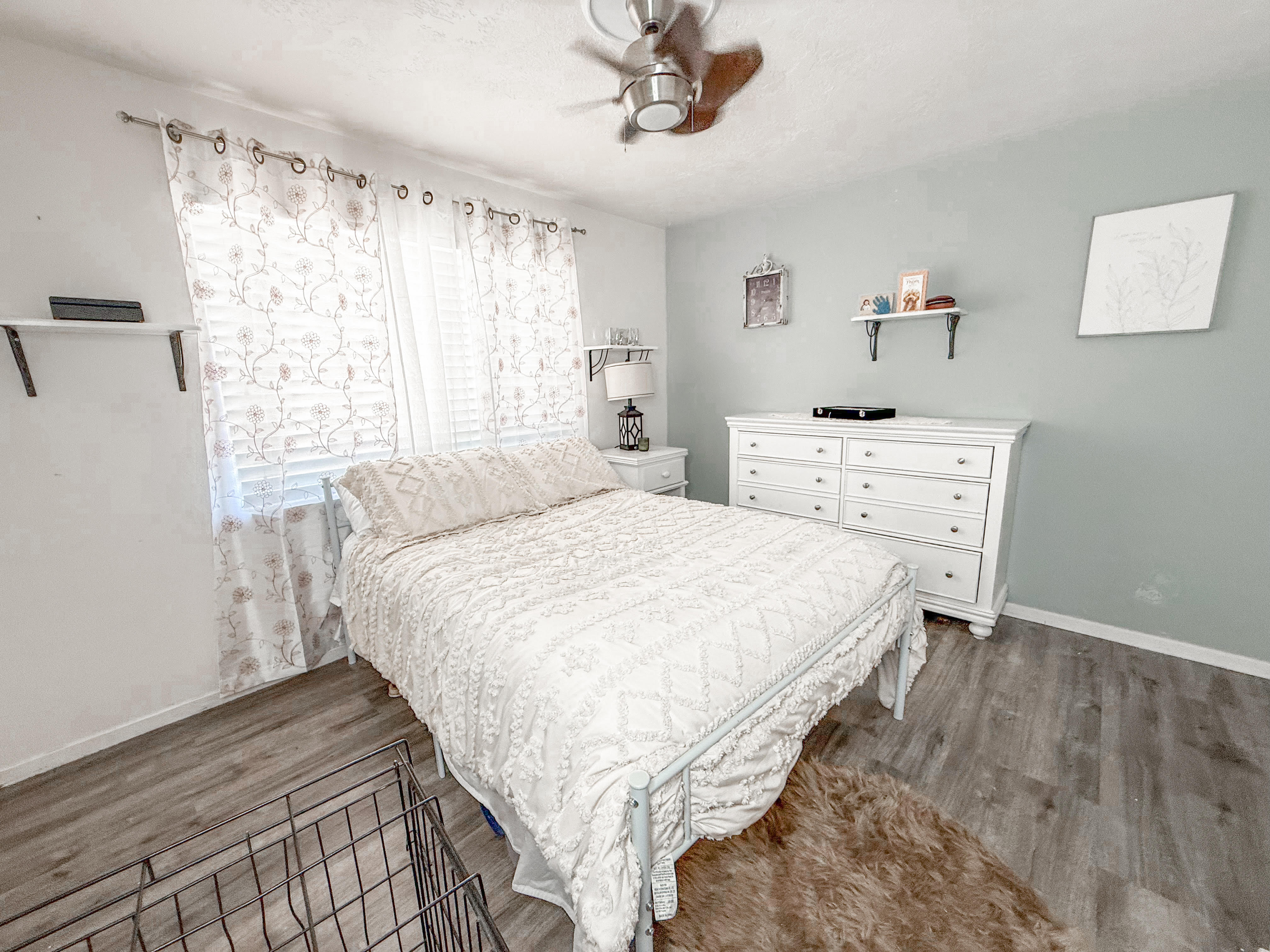 Bedroom featuring light wood-finish flooring and a ceiling fan