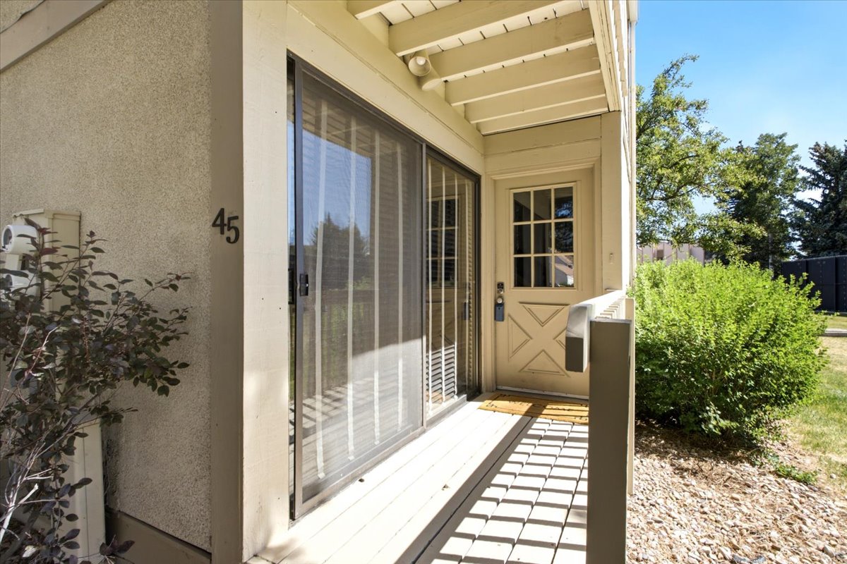 A private front entrance & covered porch welcomes you to 45 Spaulding Court.