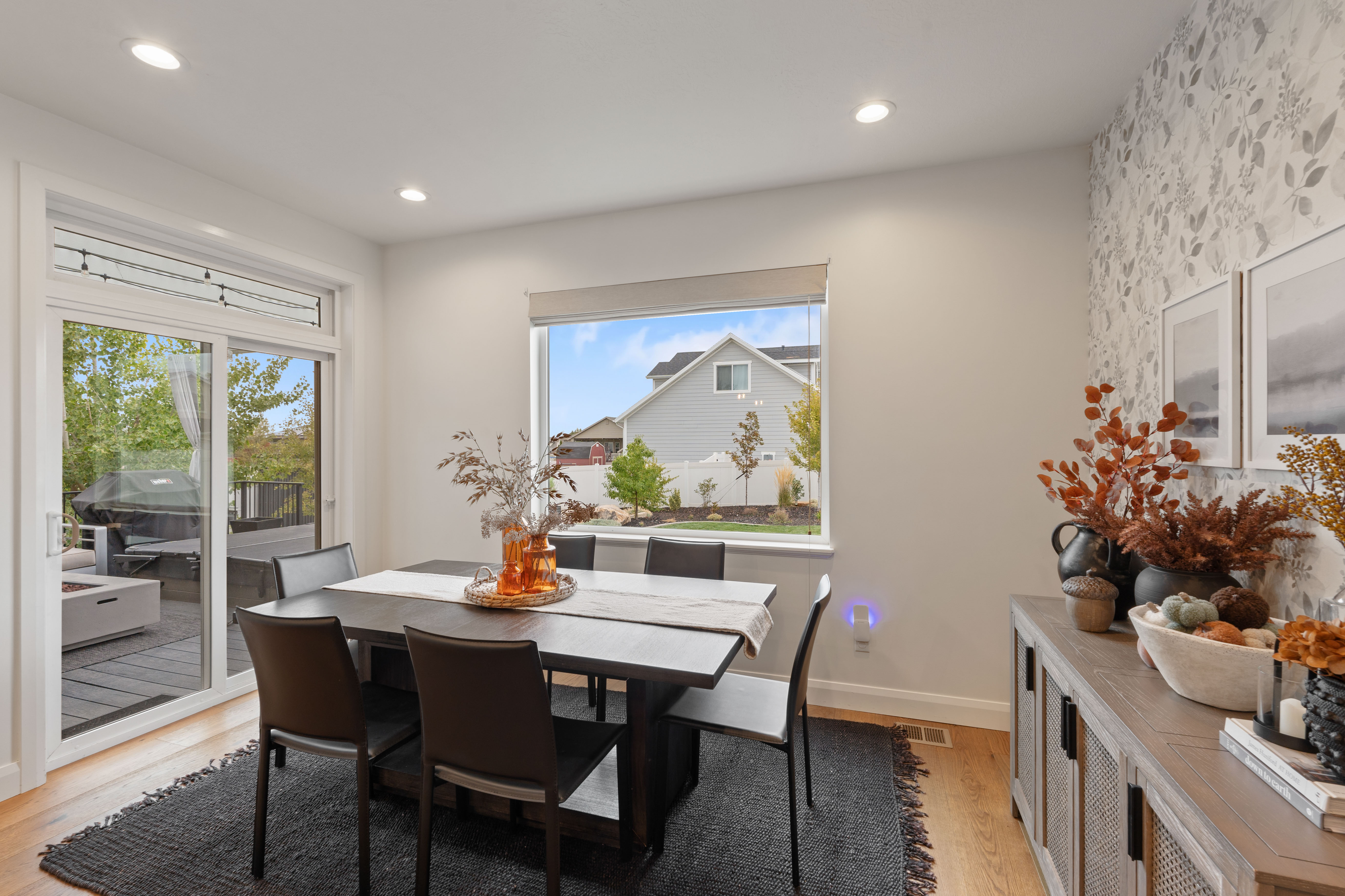 Dining area featuring light wood-finish flooring and recessed lighting