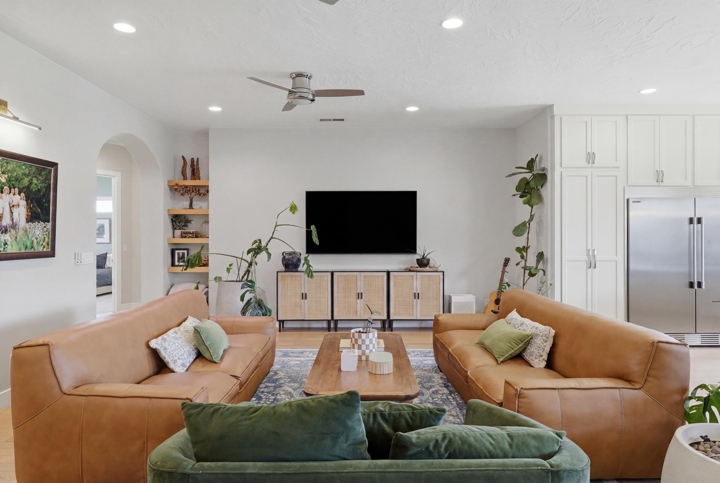 Open concept living area featuring recessed lighting, a ceiling fan, and wood-finish flooring