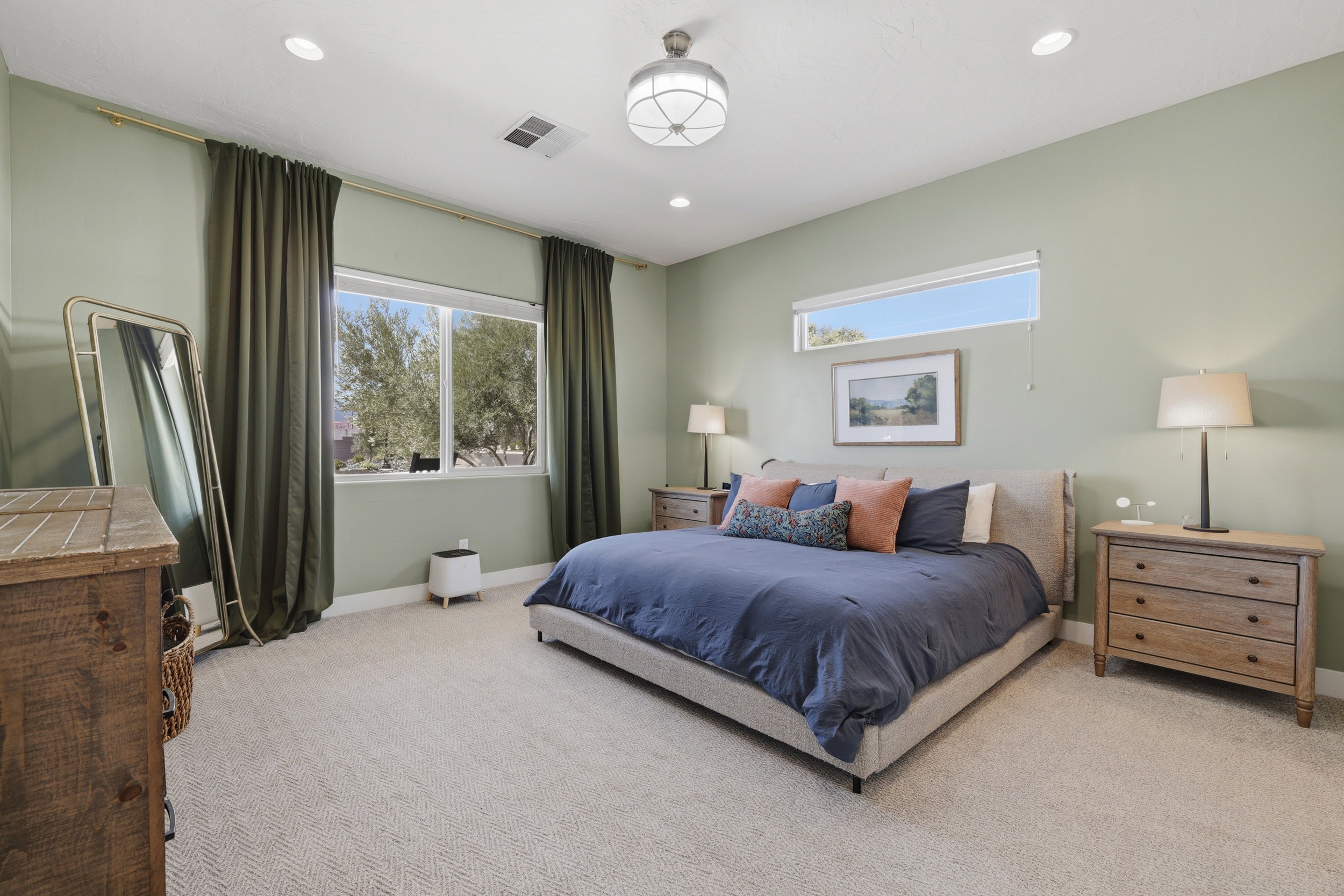 Bedroom featuring recessed lighting, a ceiling-mounted light fixture, and light green wall paint
