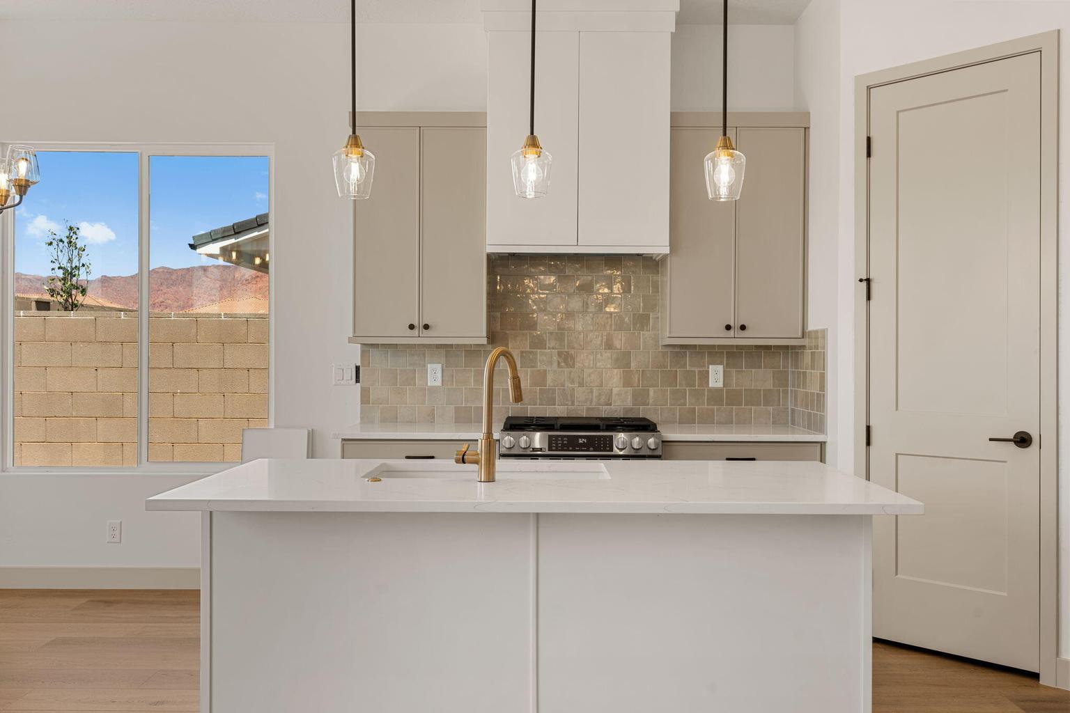 Modern kitchen island with a white countertop and integrated sink