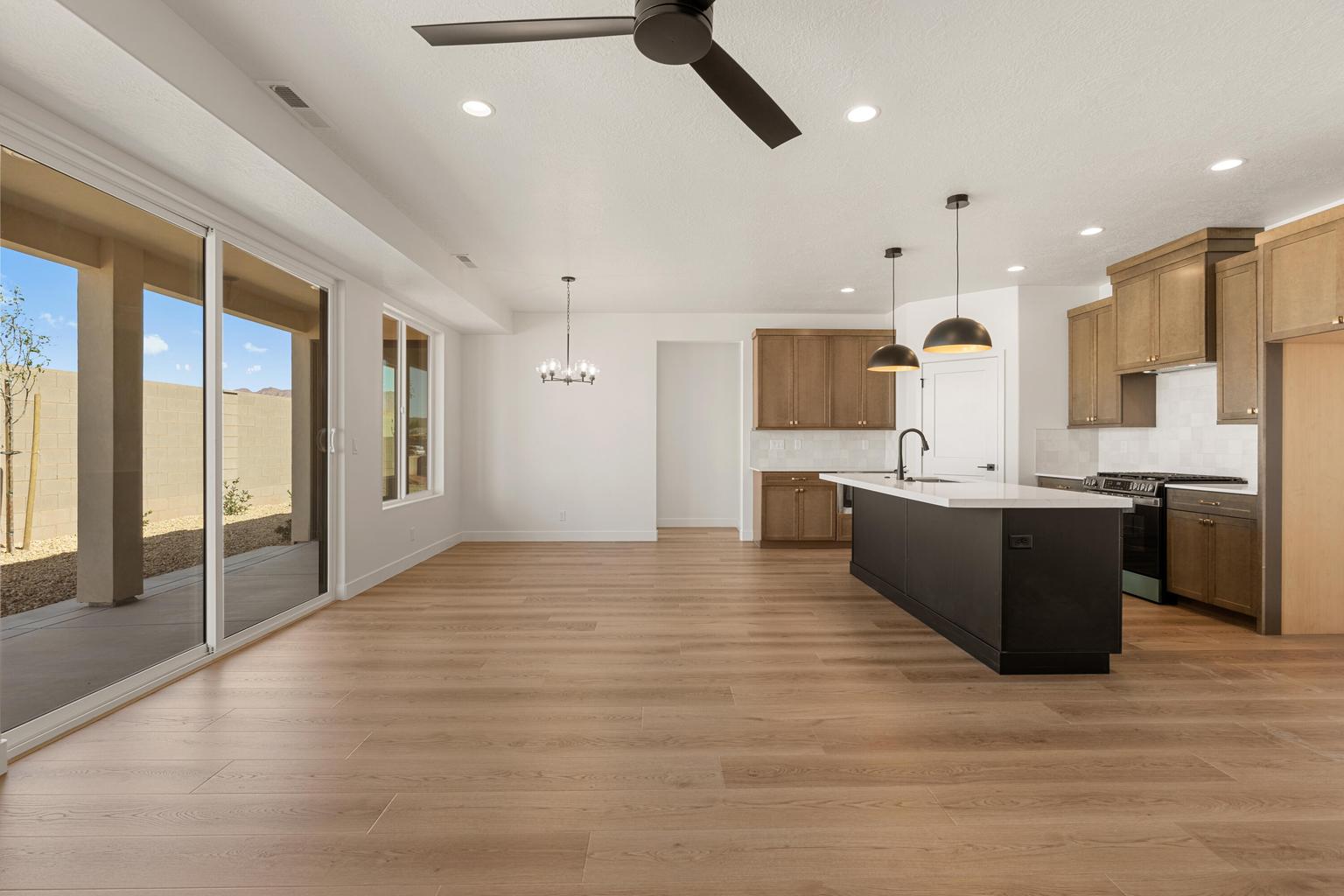Open-concept living space with wood-finish flooring