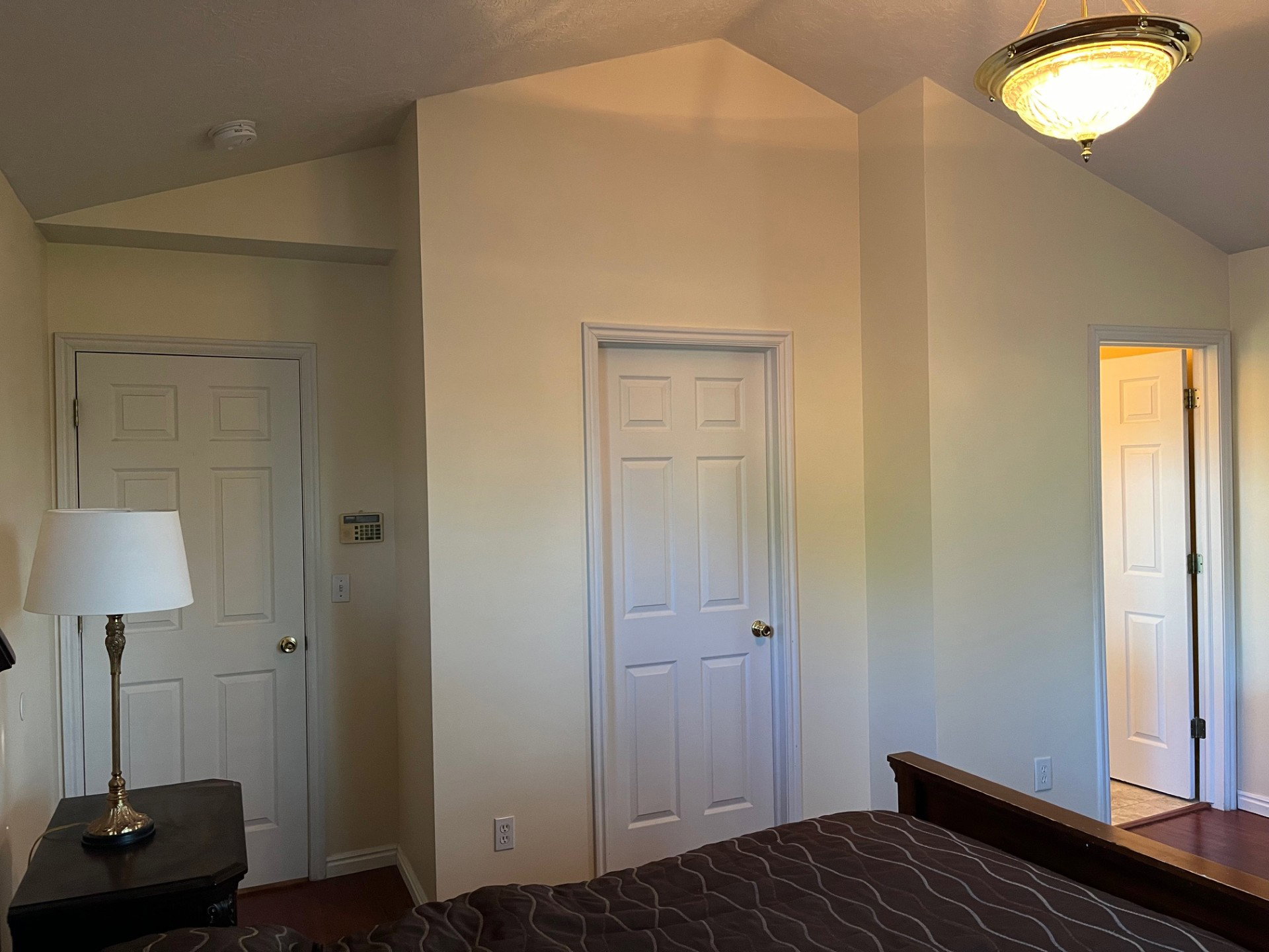 Vaulted ceilings featuring a flush-mount light fixture