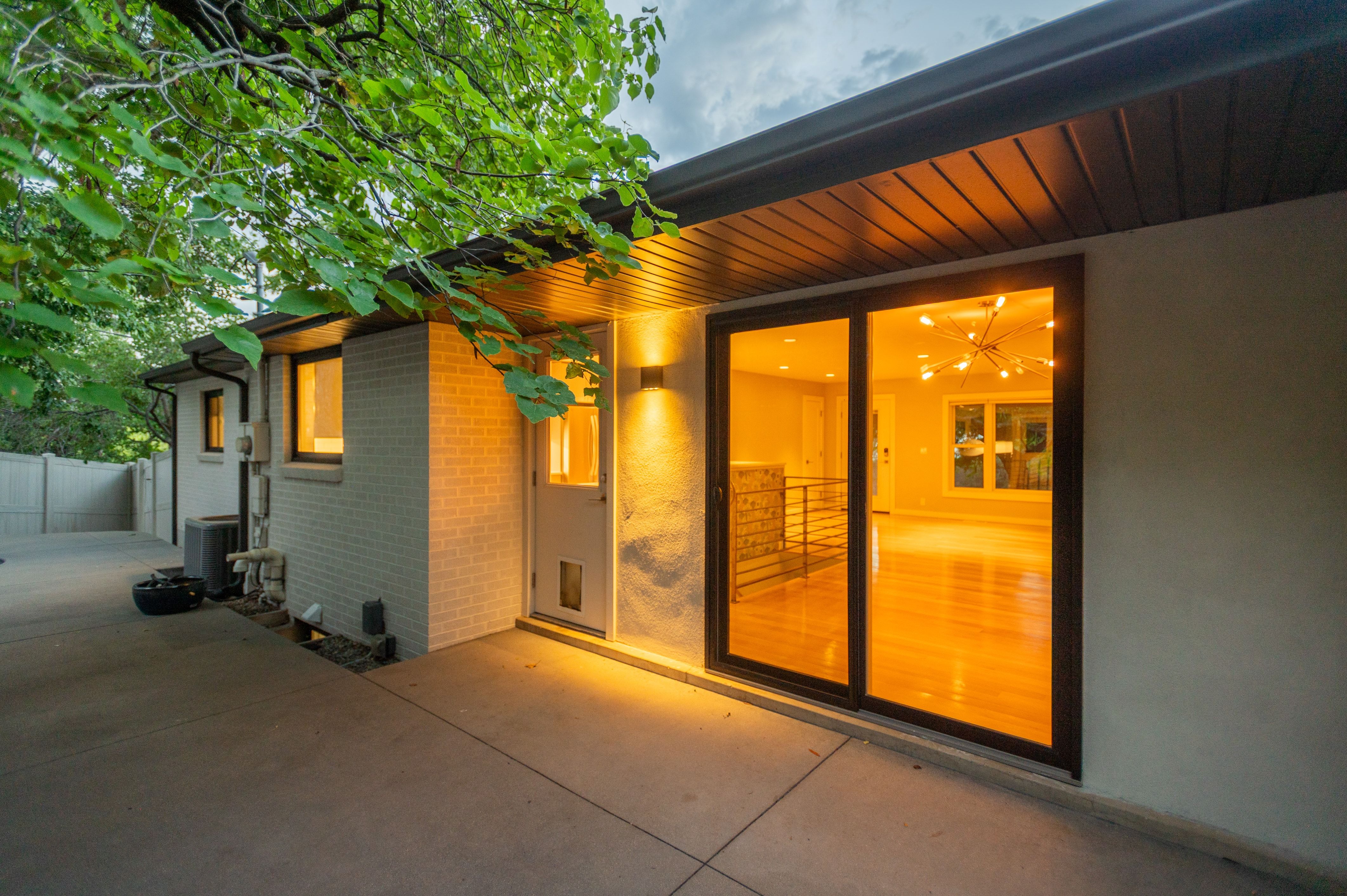 Expansive concrete patio area with direct access to interior spaces