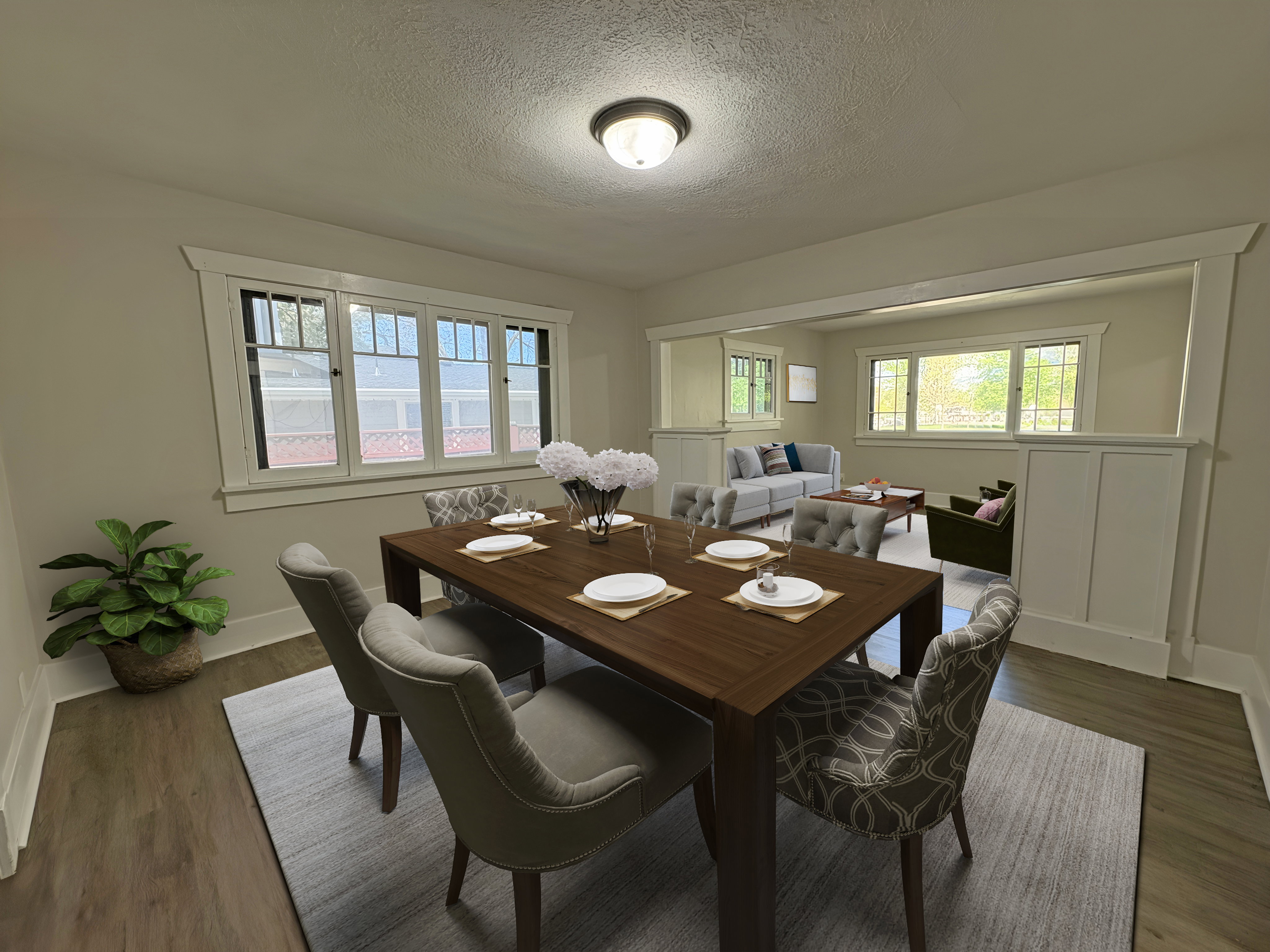 Formal dining area featuring wood-finish flooring and a central ceiling light fixture