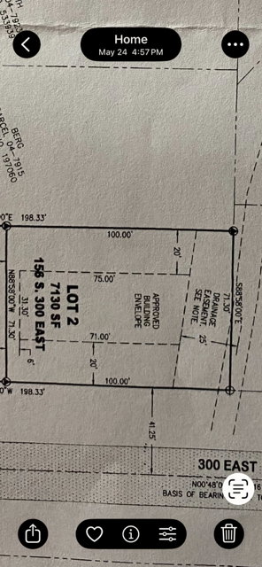 Plat Map. Illustrating lot dimensions, building envelope, and drainage easement for the property