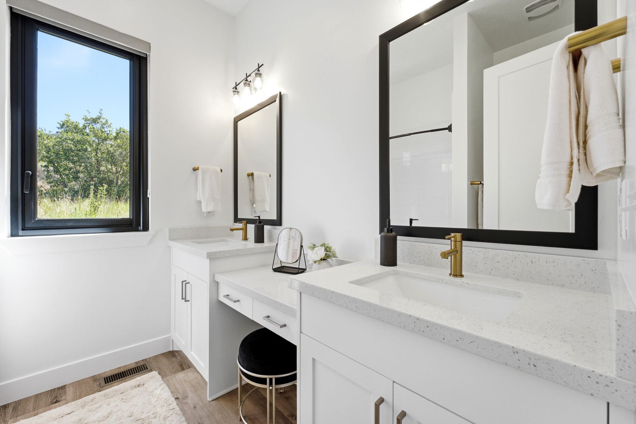 Double vanity with integrated sinks and quartz countertops