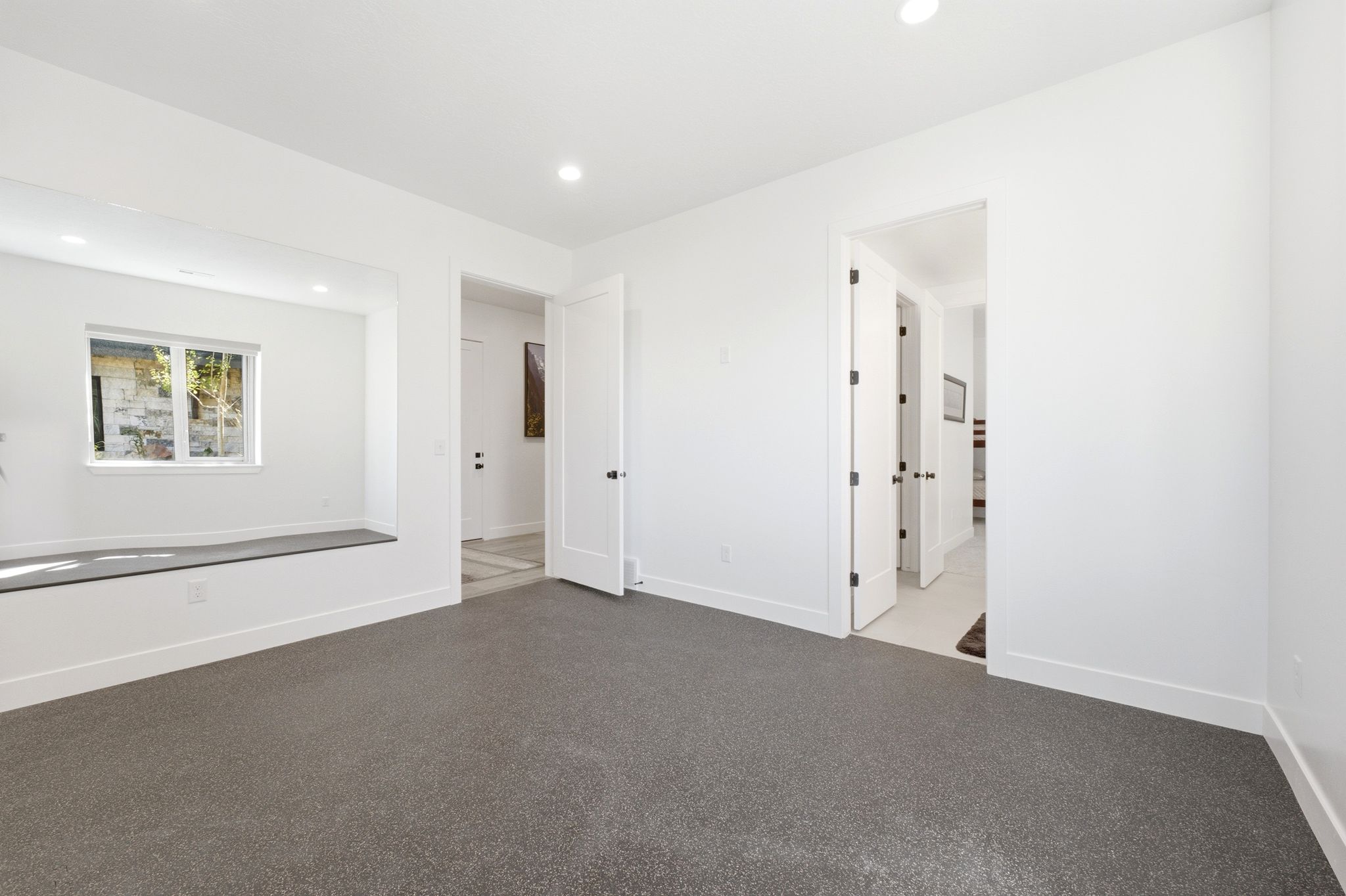 Room featuring neutral carpet flooring and white painted walls