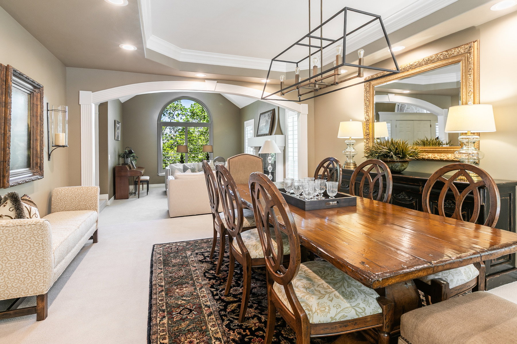 Dining area featuring a rectangular wood table and chairs with upholstered seats