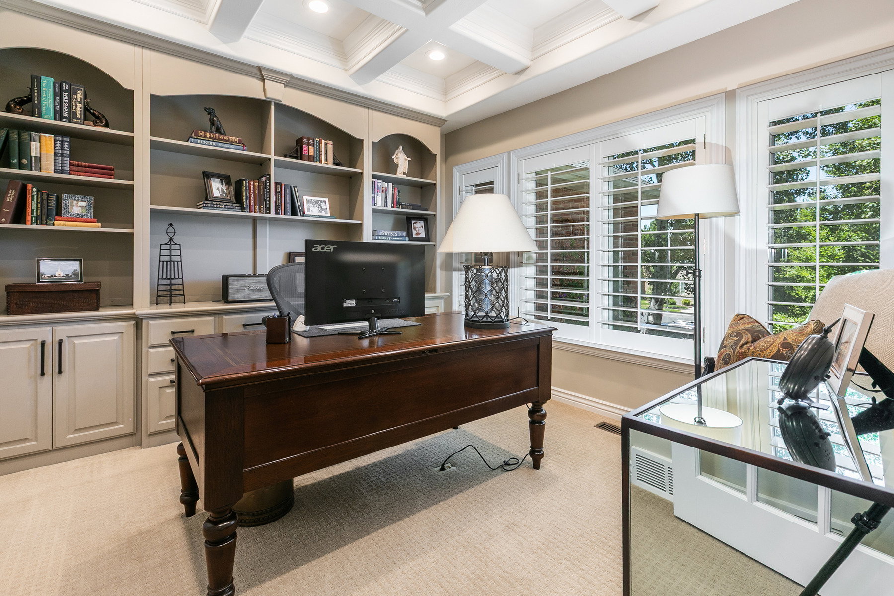 Built-in shelving and cabinetry frame a dedicated workspace