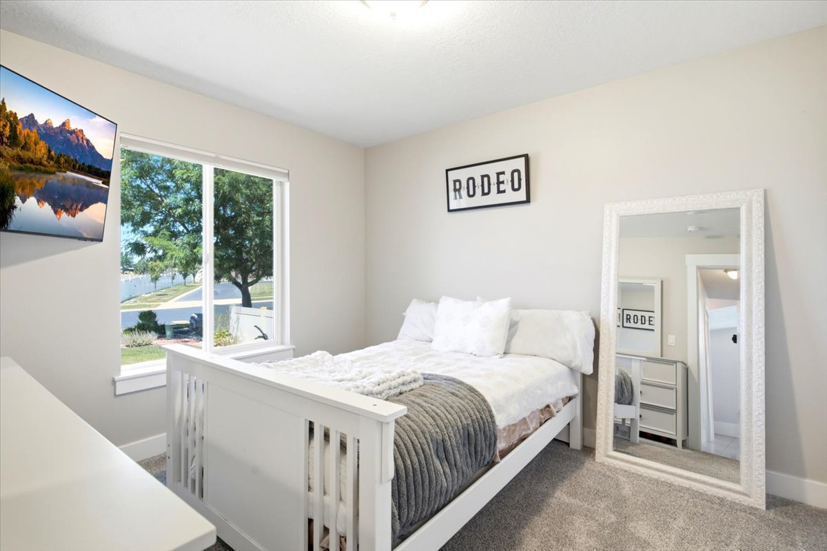 Room featuring neutral wall tones and a window with white trim