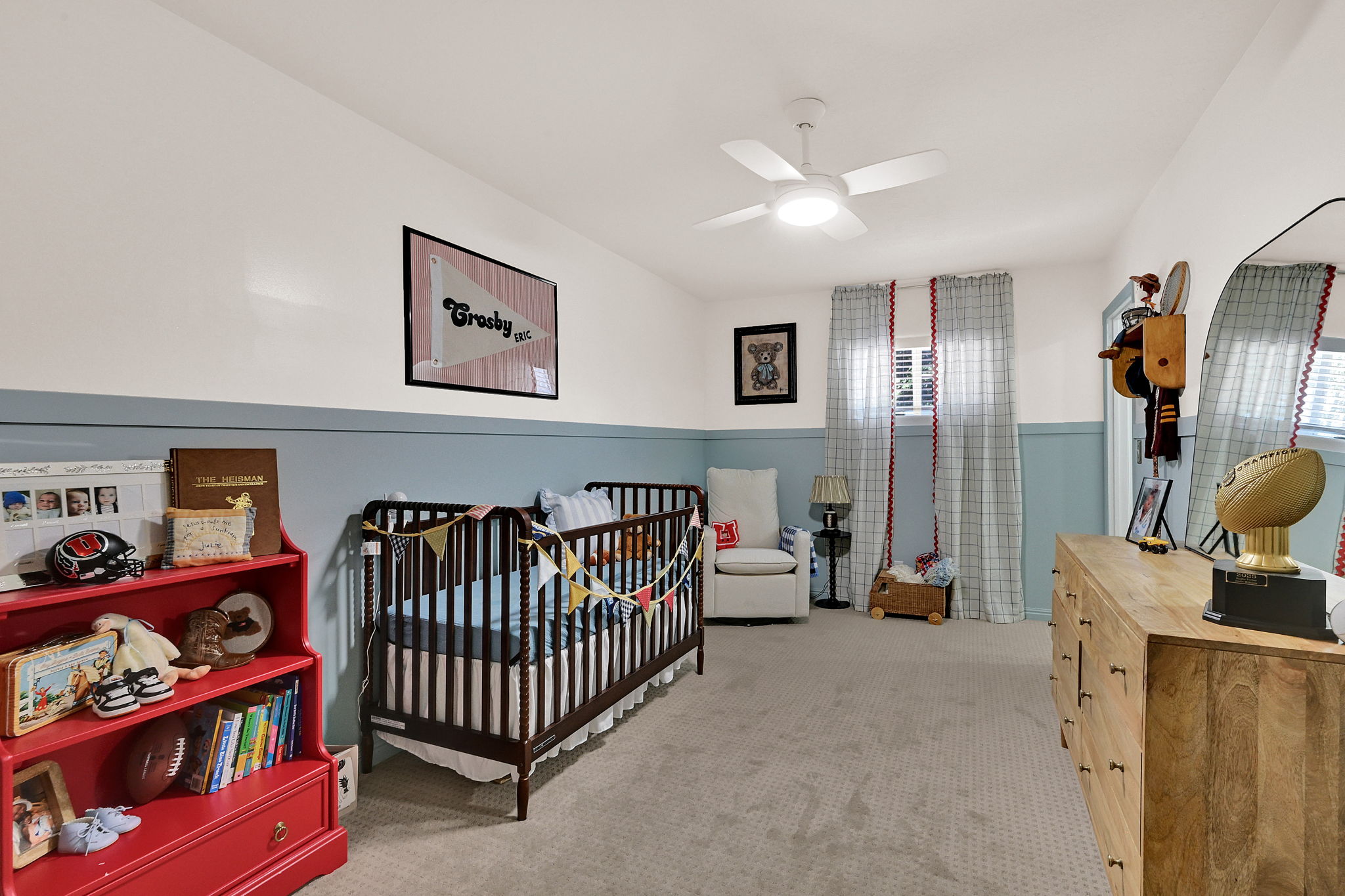 Bedroom #2 - Spacious room featuring carpet flooring, a ceiling fan with integrated lighting, and a two-tone wall treatment