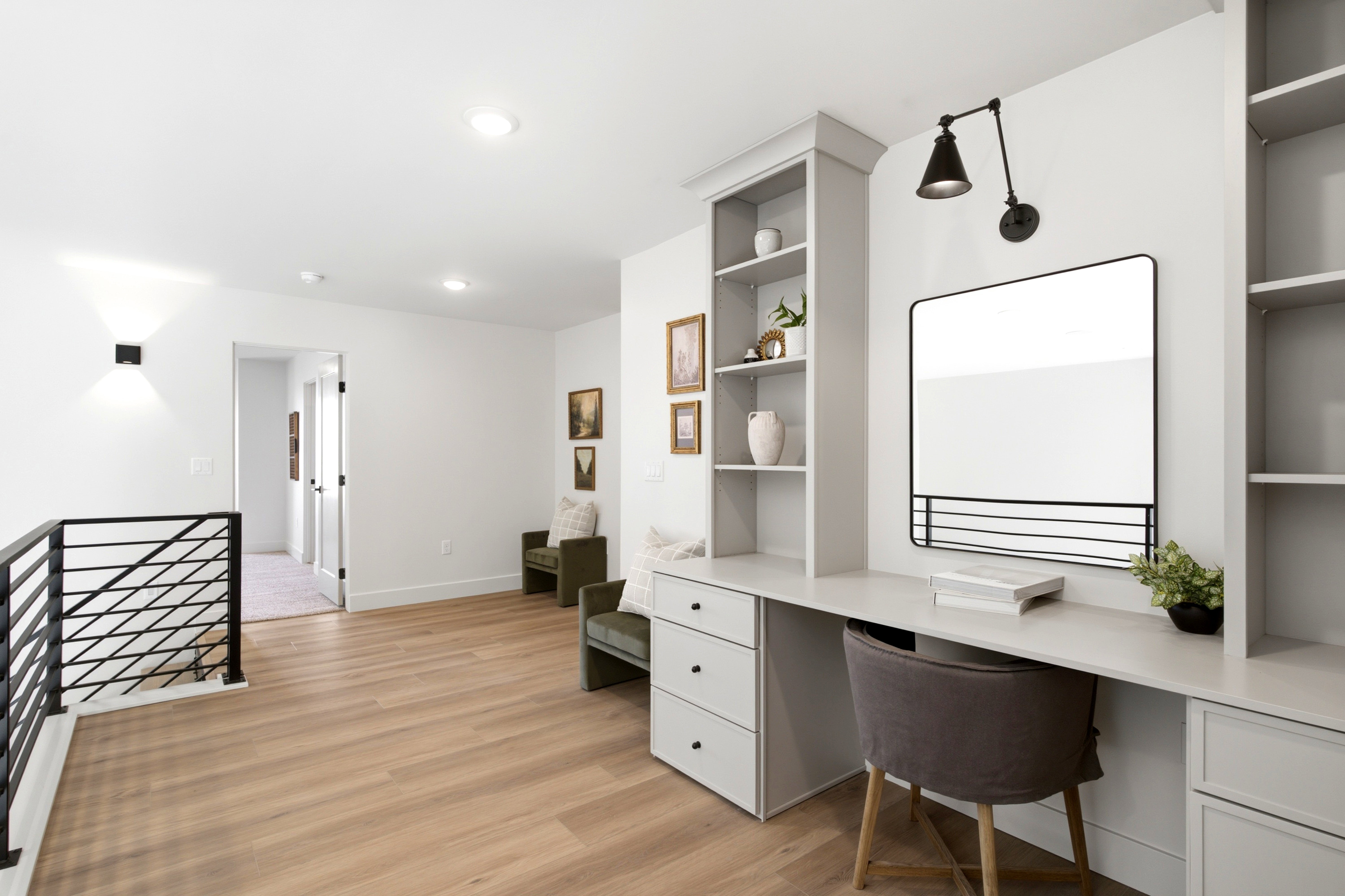 Dedicated office area with built-in cabinetry and expansive desk space
