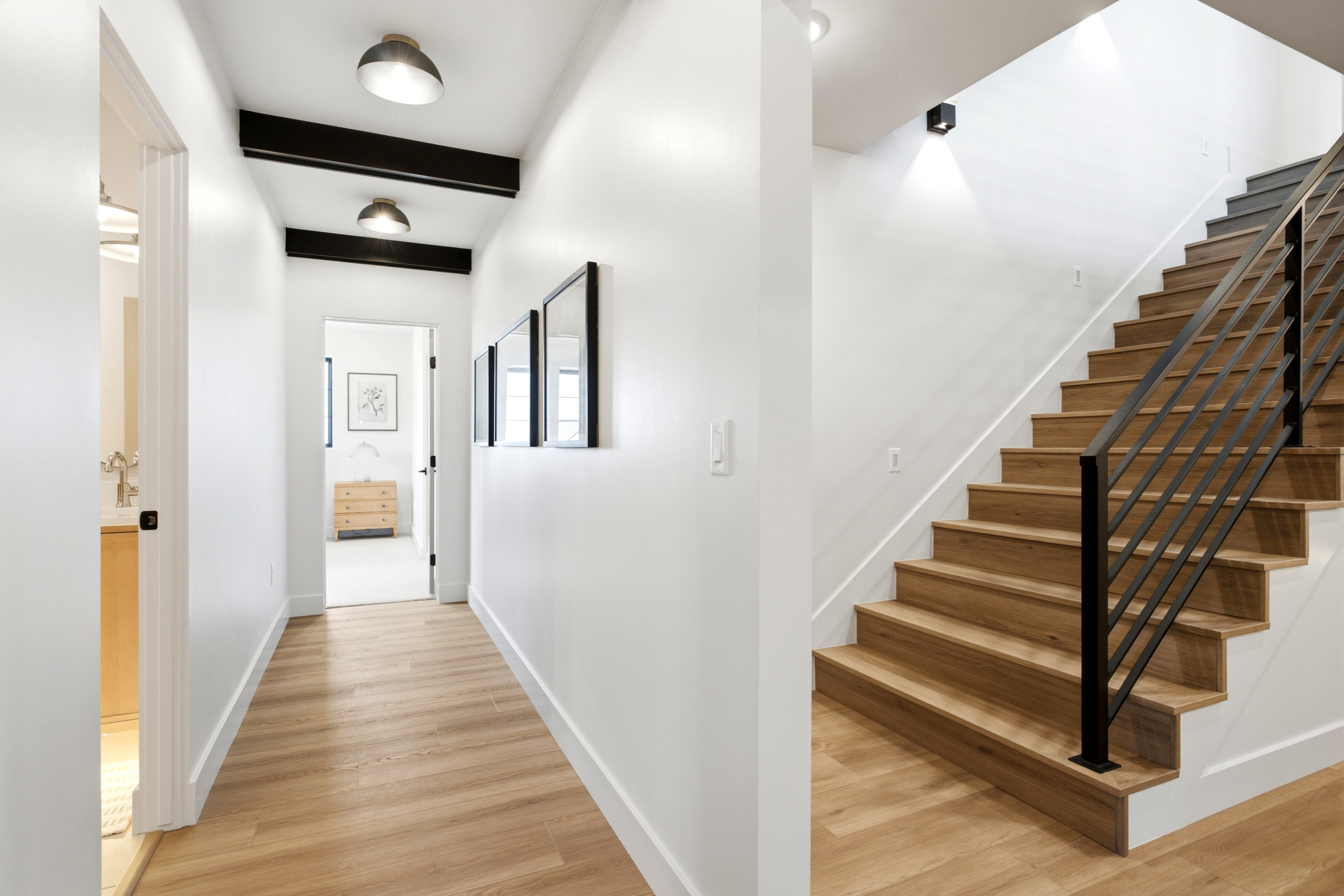 Contemporary interior featuring light wood-finish flooring throughout