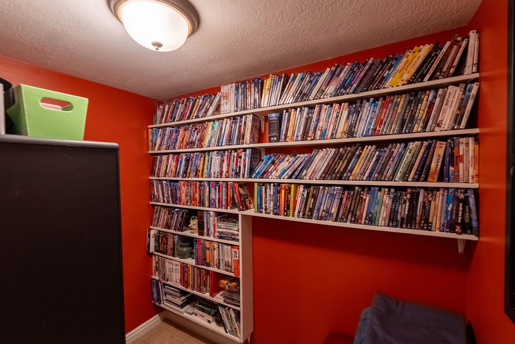 Built-in wall shelving with multiple tiers providing extensive storage