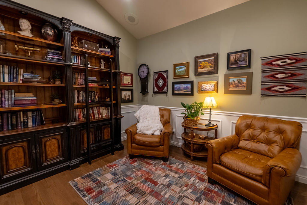 Built-in custom cabinetry with a rolling ladder system and integrated storage