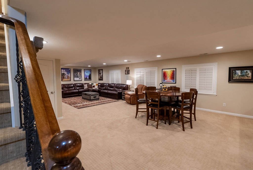 Lower level featuring recessed lighting, carpeting, and plantation-style window shutters