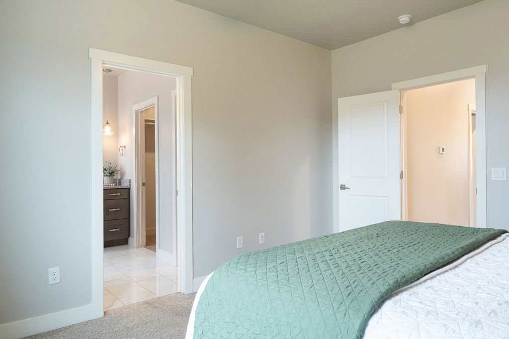 Neutral wall finishes and white trim create a bright interior