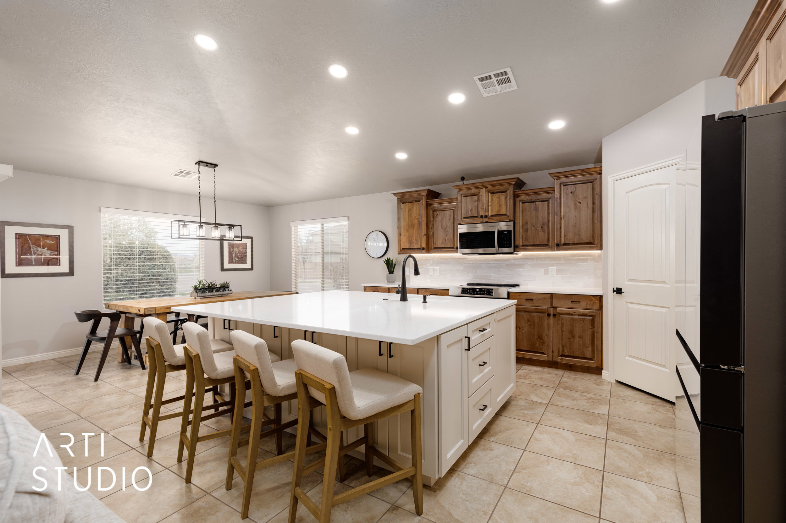 Large custom kitchen island with bar seating and lots of storage.