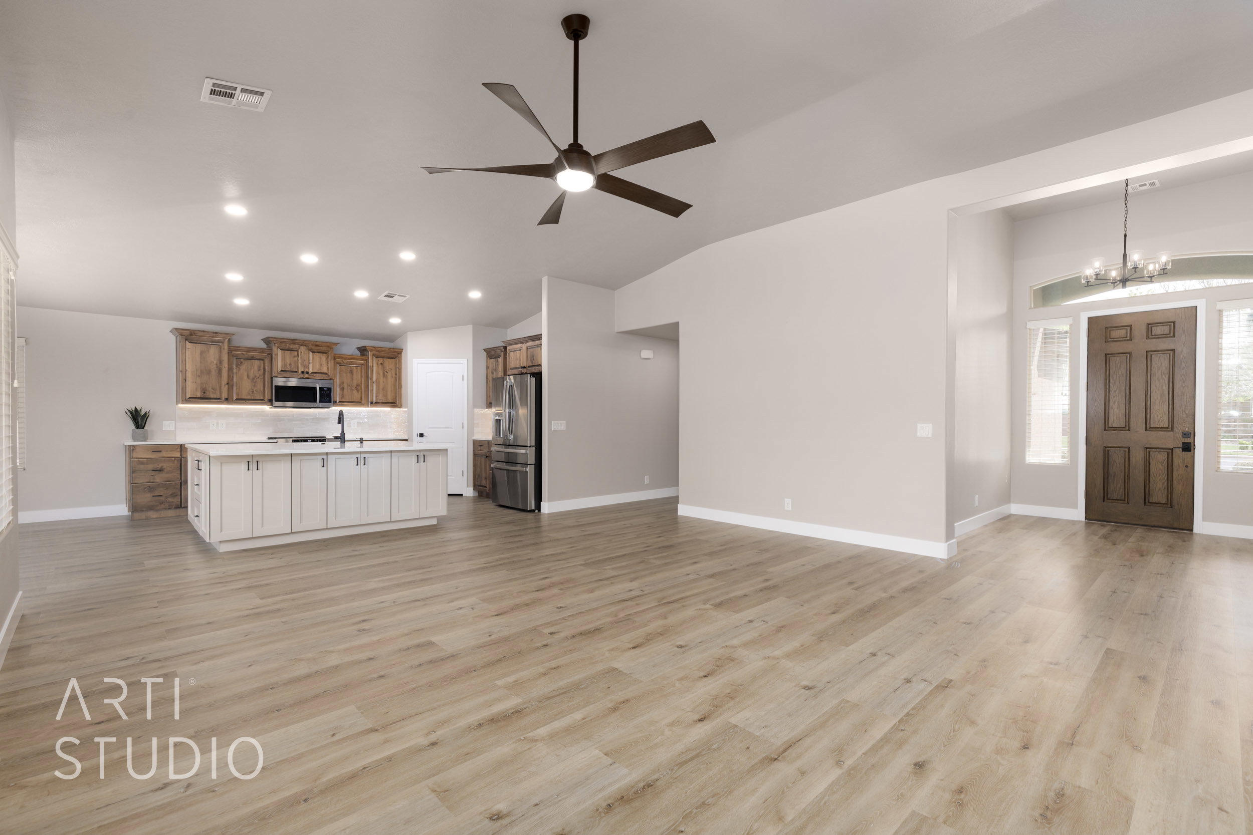 Open concept living, kitchen and dining featuring new LVP flooring.