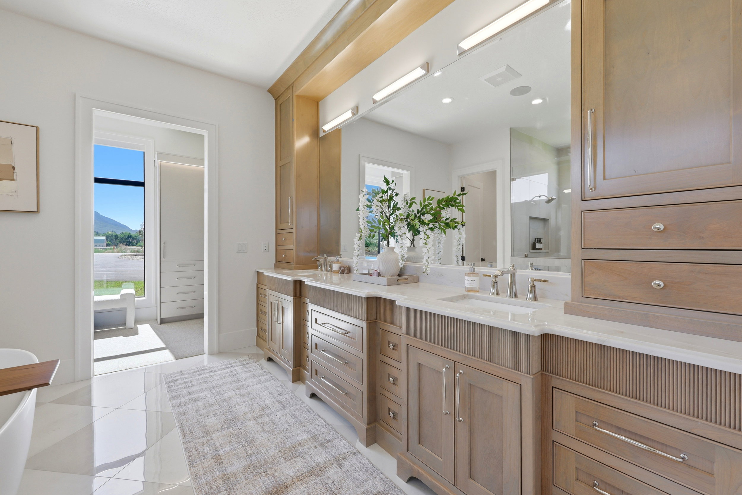 Primary ensuite bathroom with double vanity