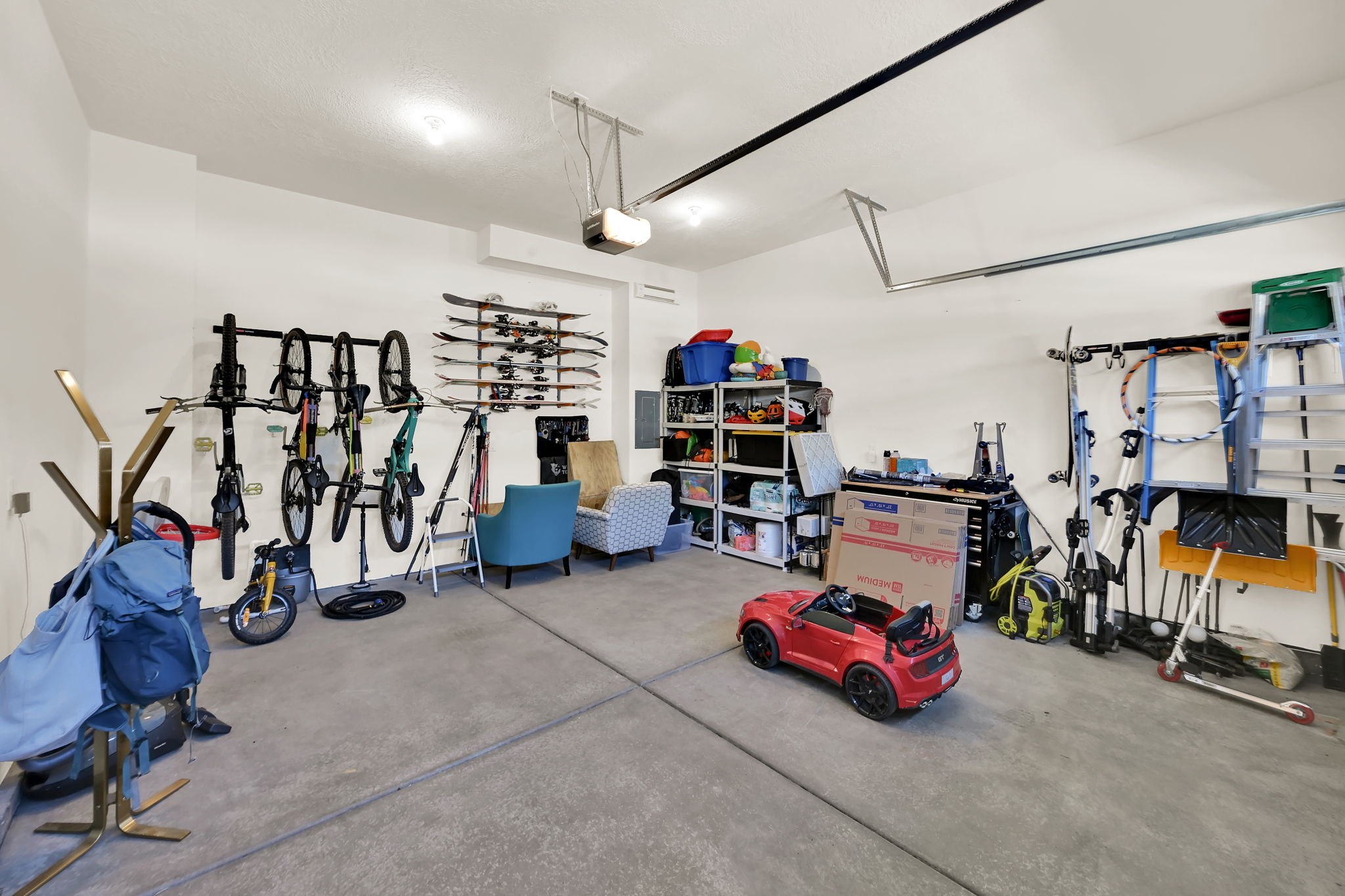 Spacious garage featuring concrete flooring and white walls