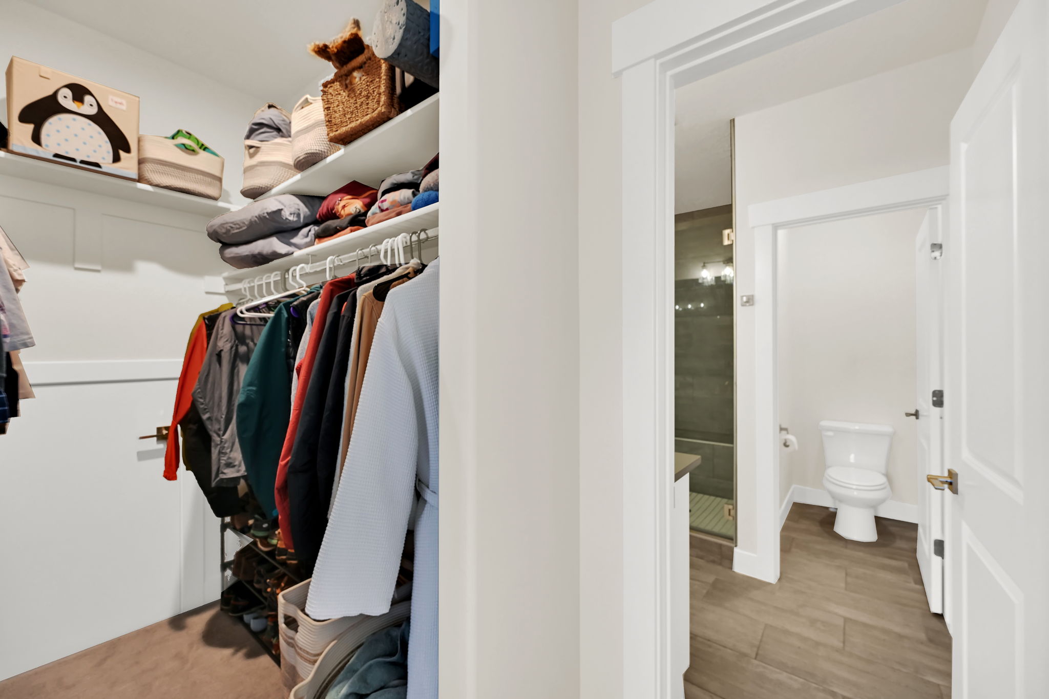 Walk-in closet with integrated shelving and hanging rods