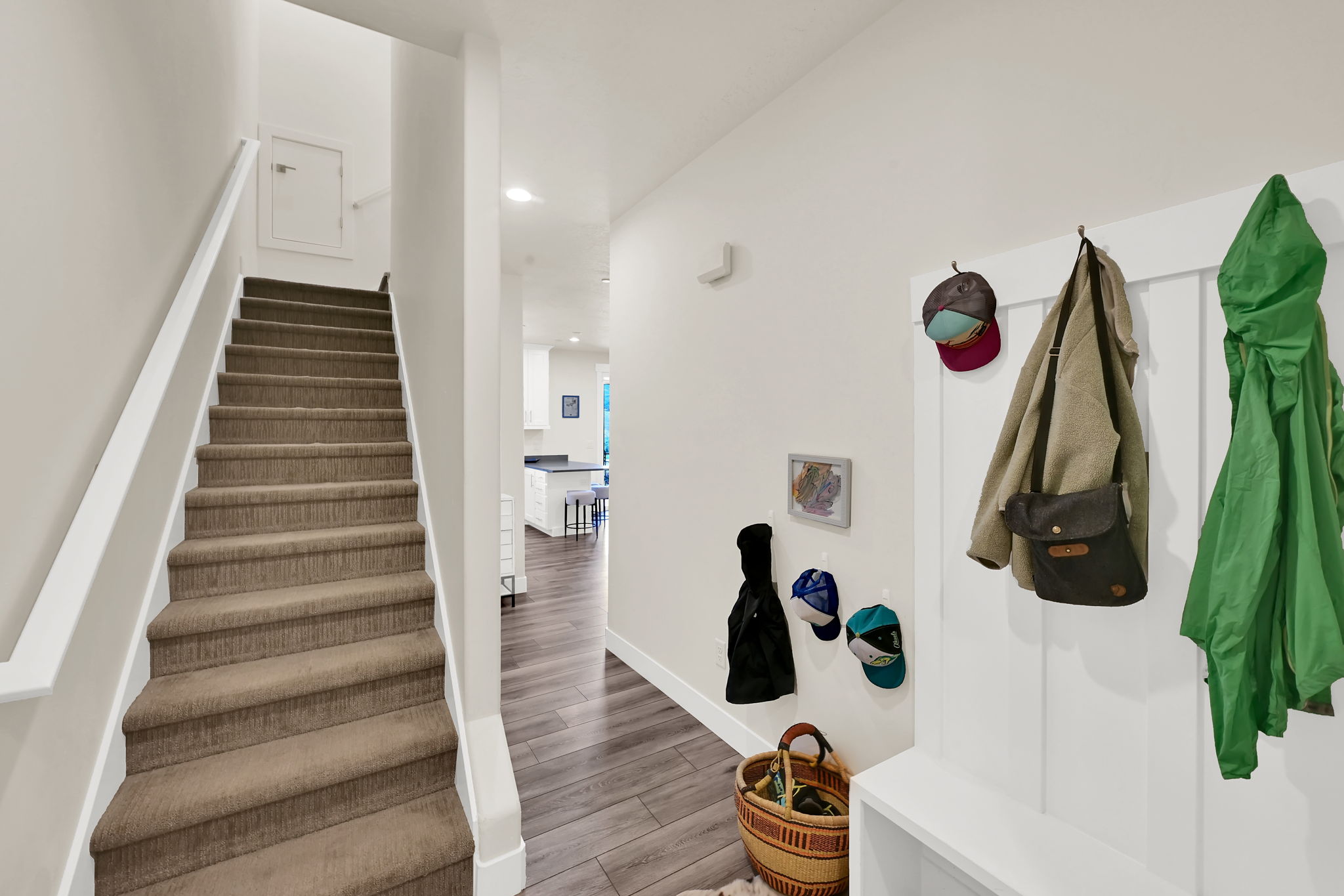 Carpeted staircase with white trim