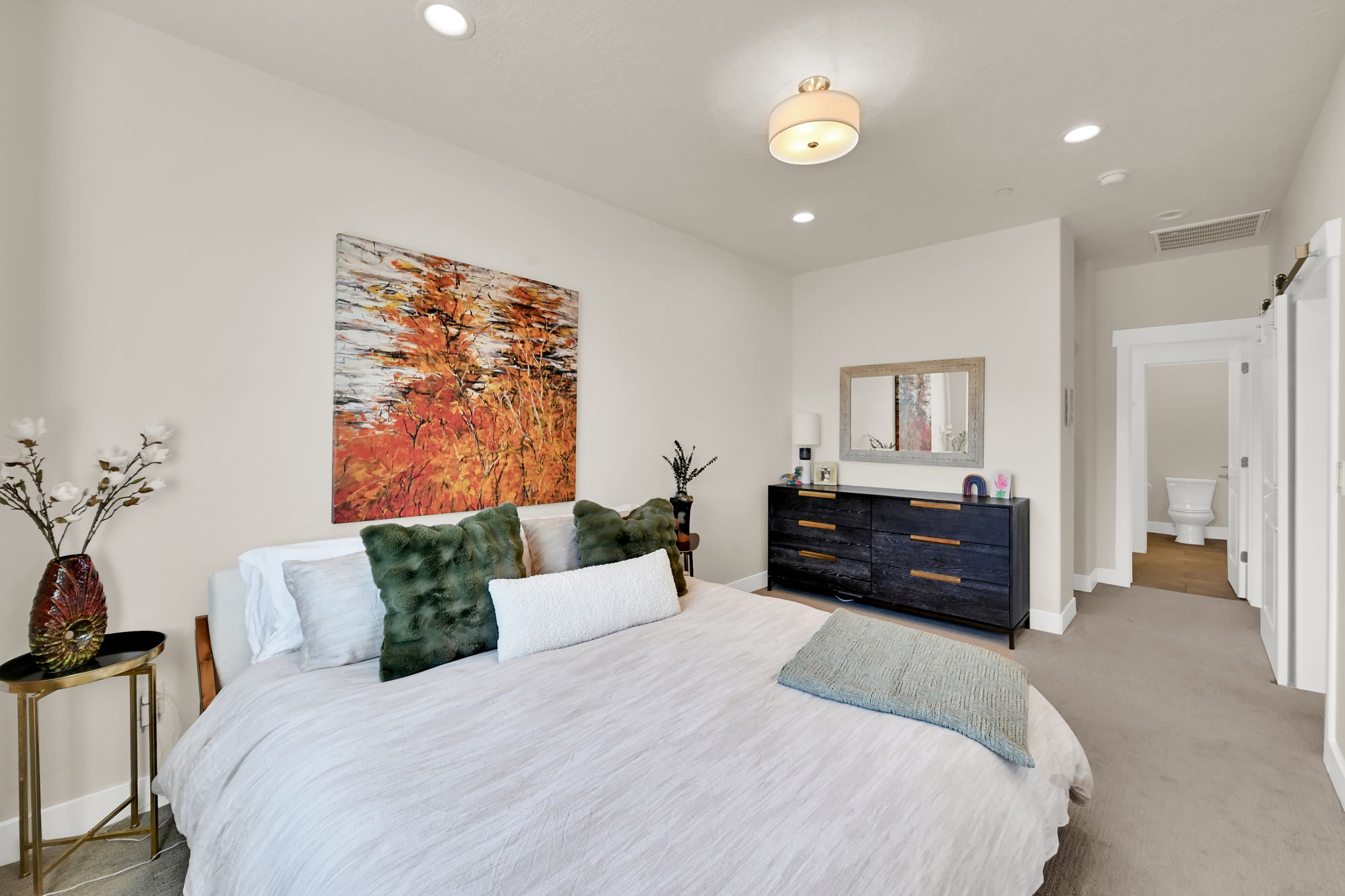 Neutral-toned bedroom featuring recessed lighting and a central ceiling fixture