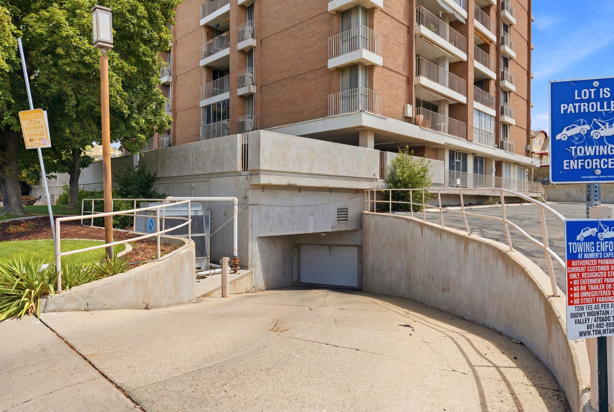 Concrete ramp leading to subterranean parking garage