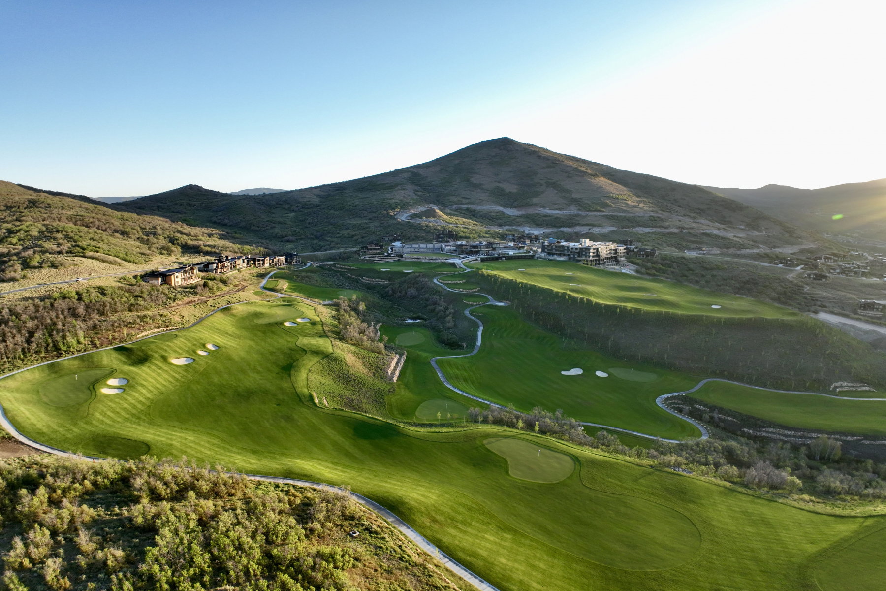 Expansive golf course with manicured greens and sand traps
