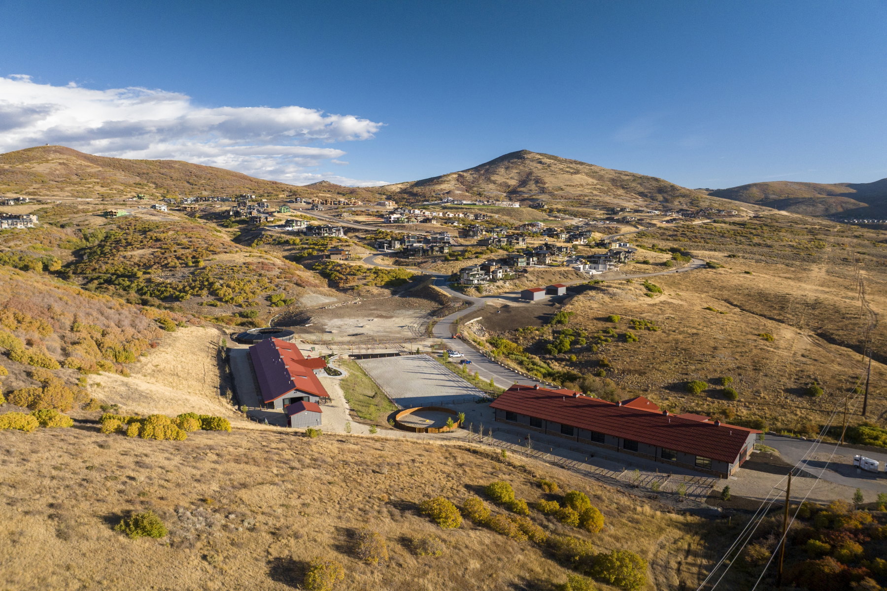 Expansive mountainous landscape with scattered residential properties