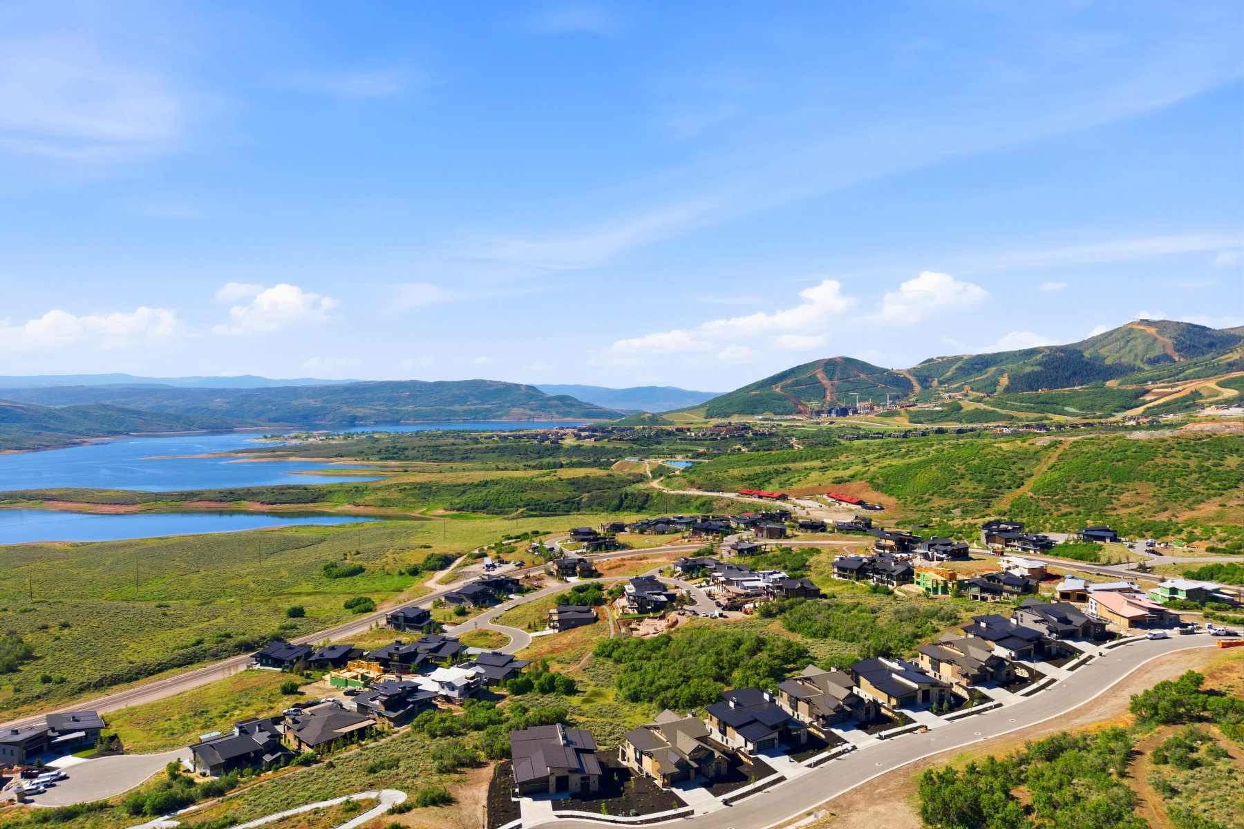 Expansive development with contemporary residences overlooking a large body of water