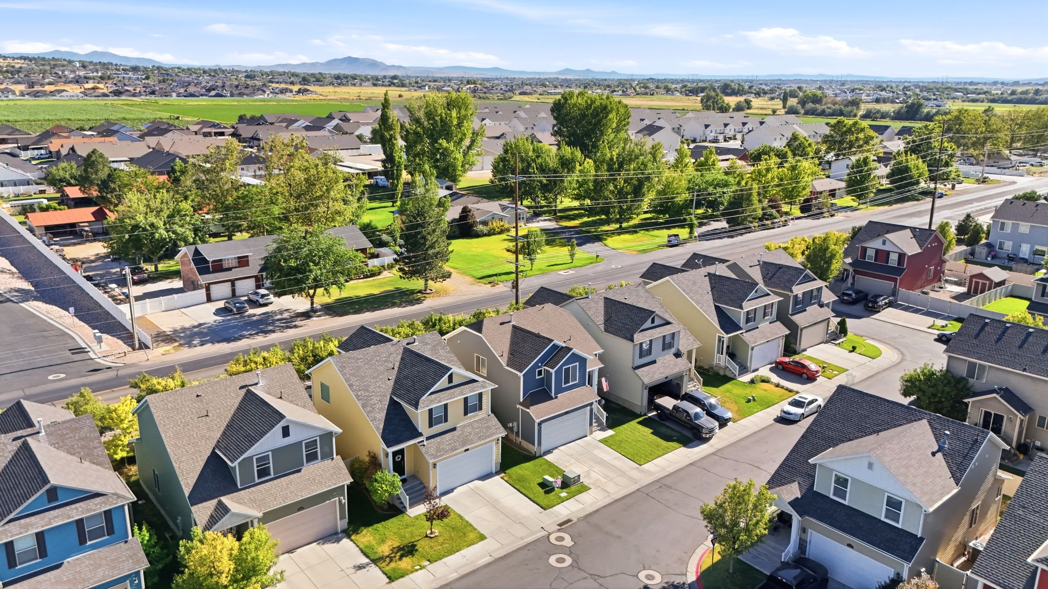 Aerial view showcasing a residential neighborhood with varied two-story homes