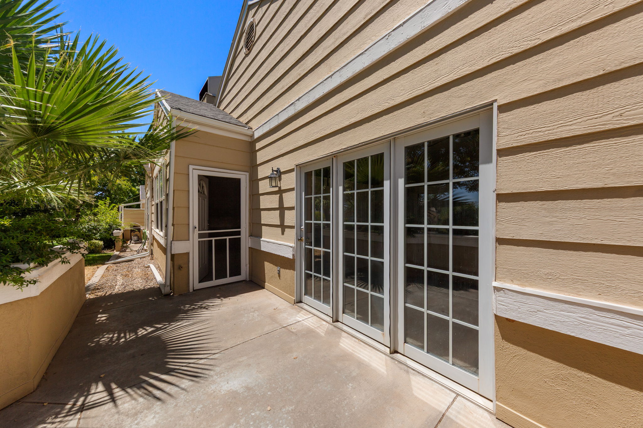 Private patio with concrete flooring