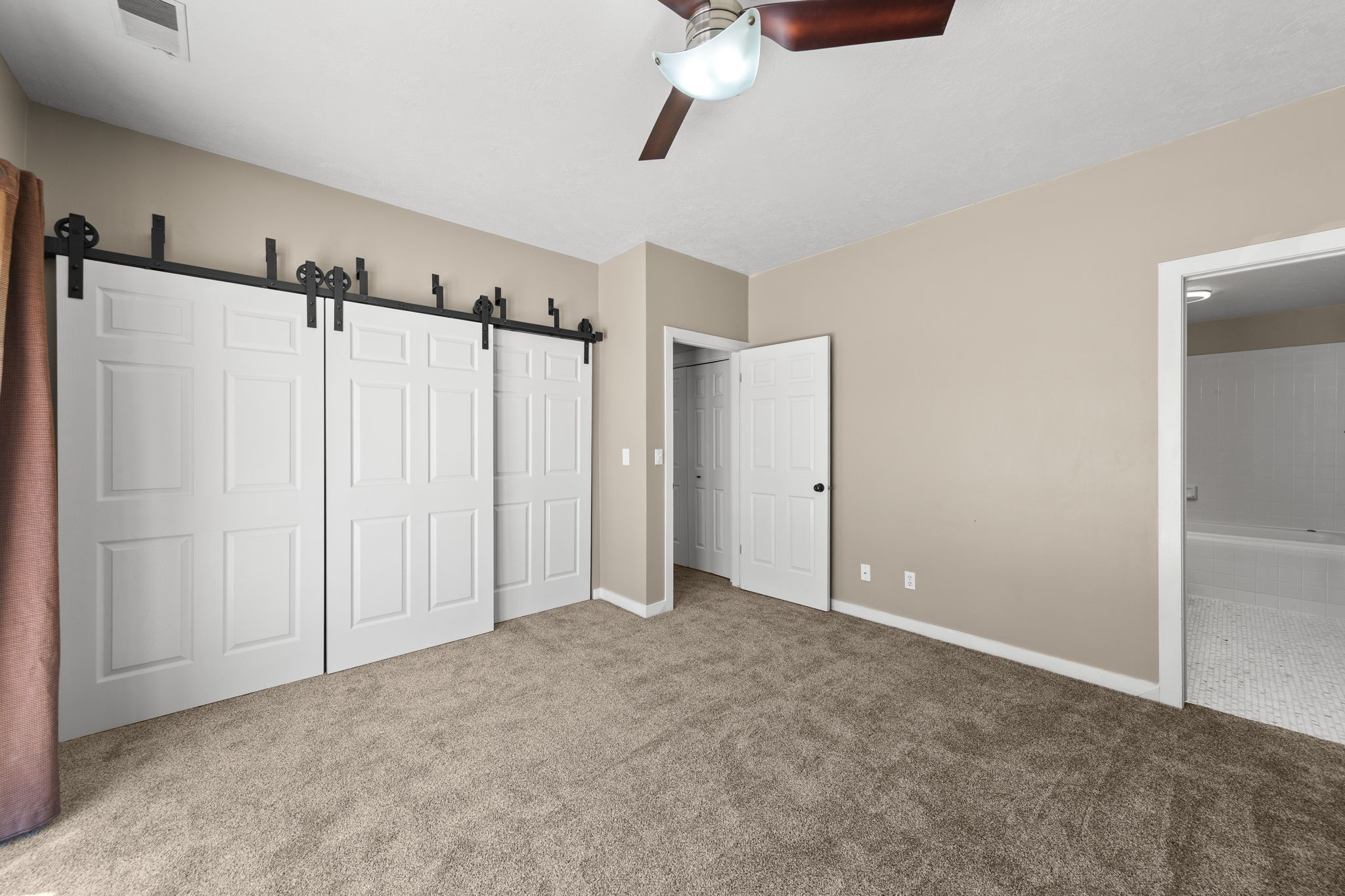 Neutral tone wall color with textured carpeting