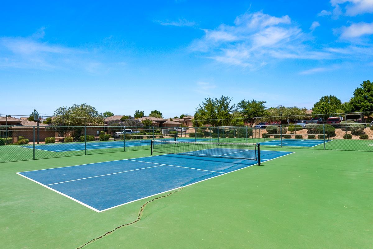 Outdoor recreational courts featuring blue and green surfacing