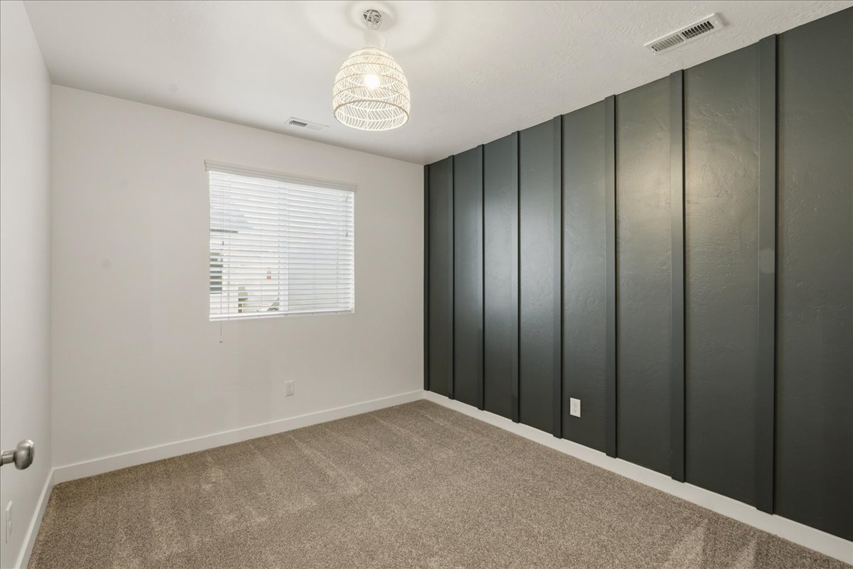 Accent wall featuring vertical paneling