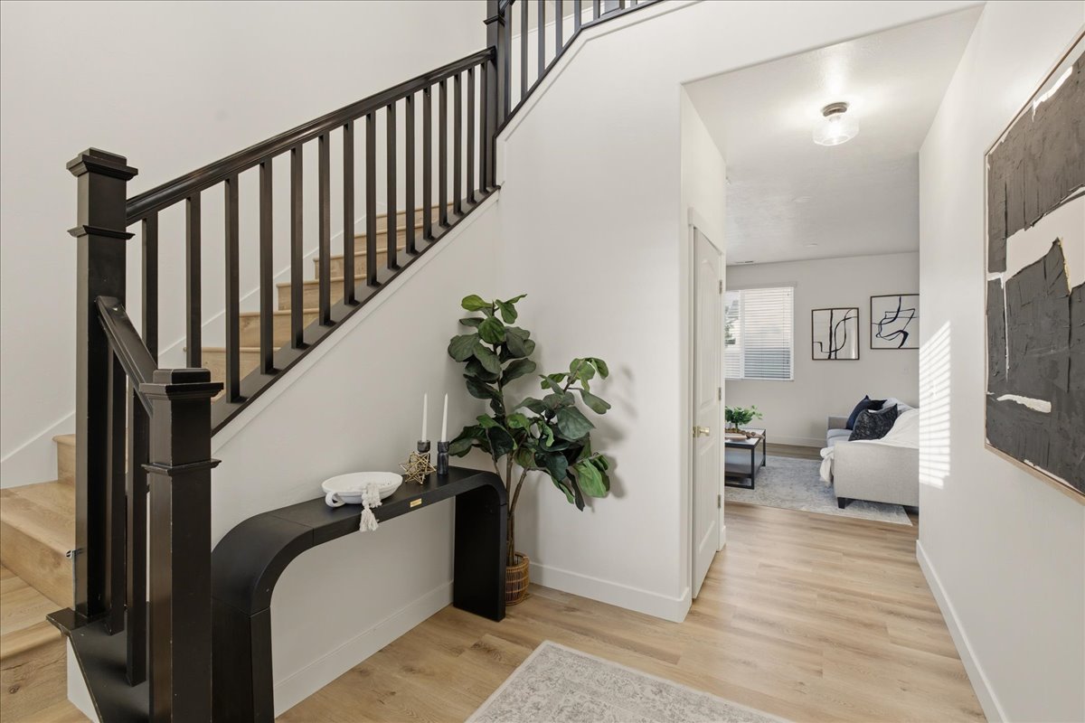 Staircase with dark wood balusters and light wood treads