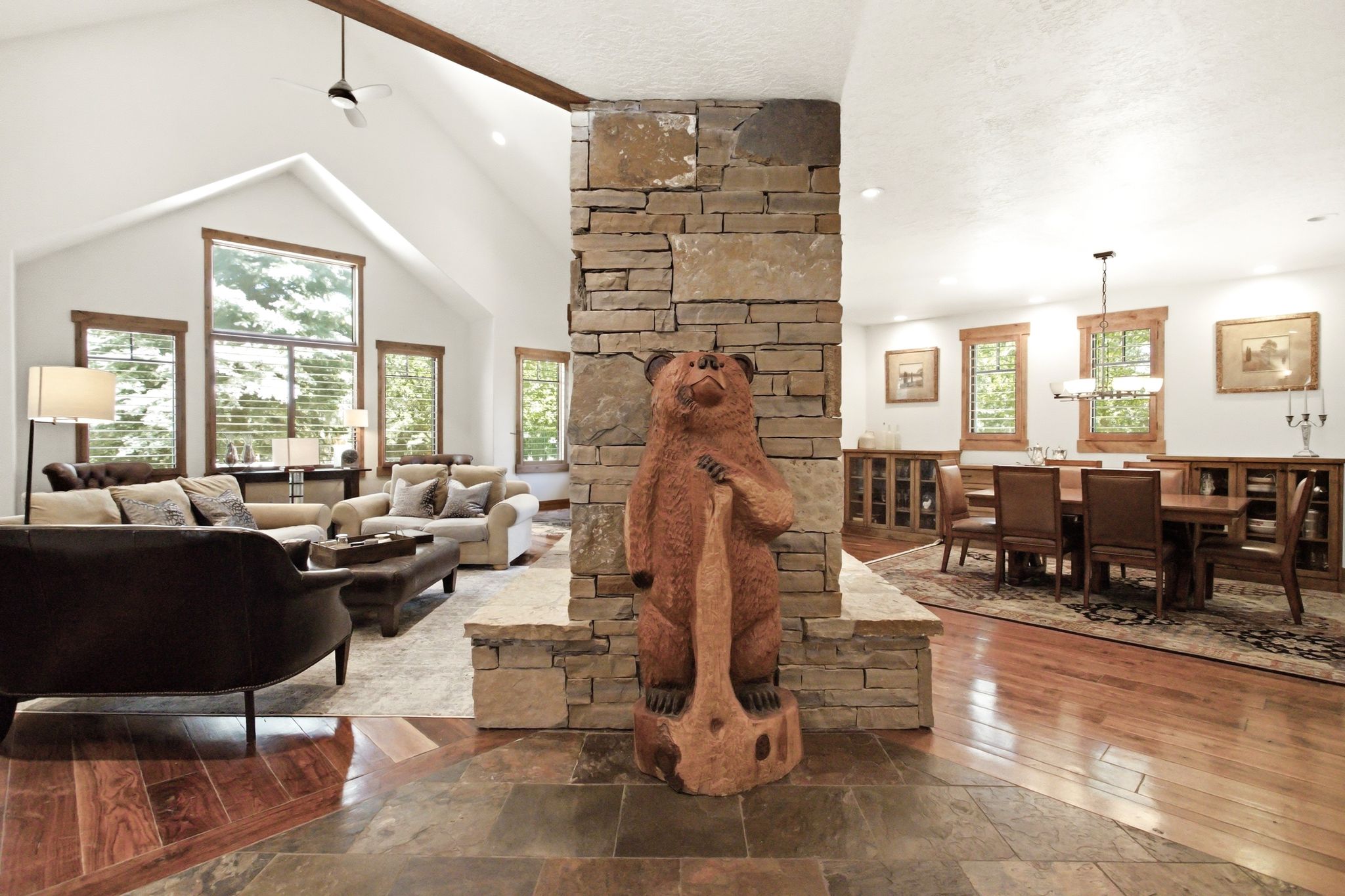 Vaulted ceilings with exposed wood beam and ceiling fan