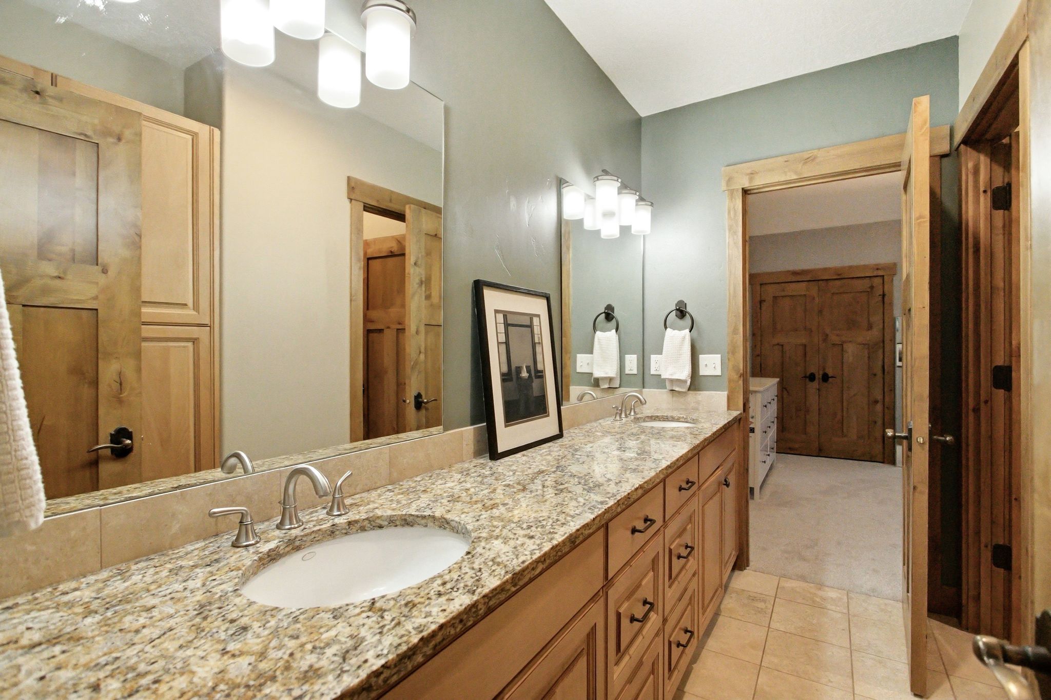 Dual vanity with granite-finish countertop and undermount sinks