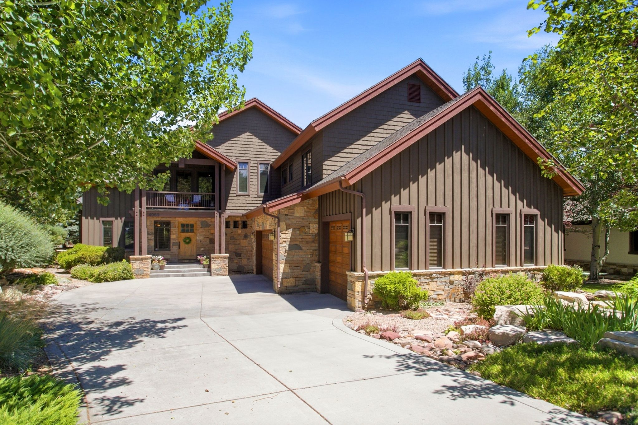 Property exterior featuring stone accents and wood-finish siding