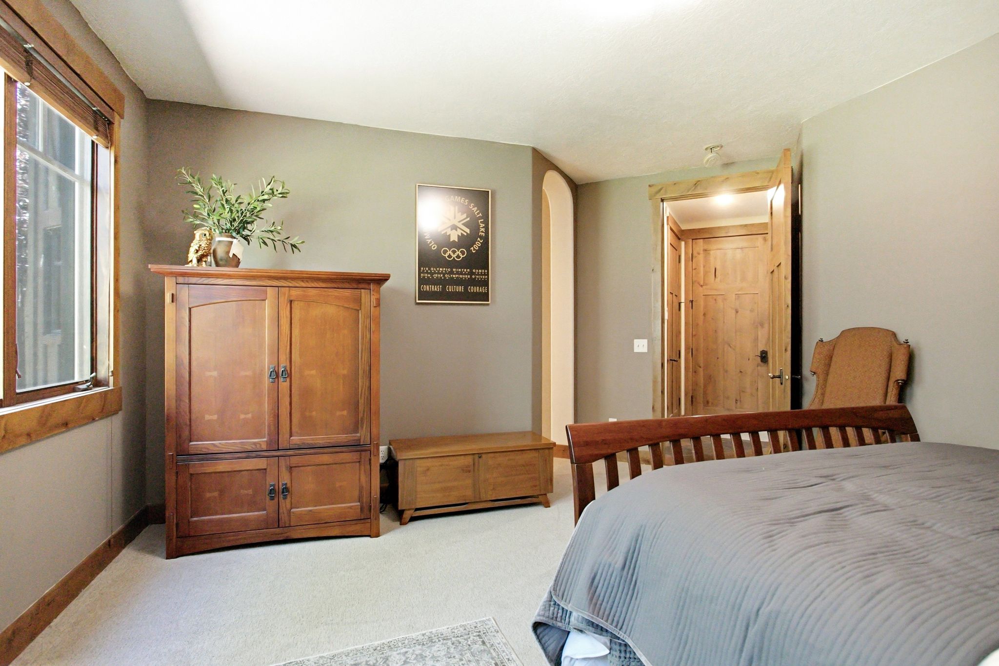 Warm wood-finish window trim and door frames complement neutral wall tones
