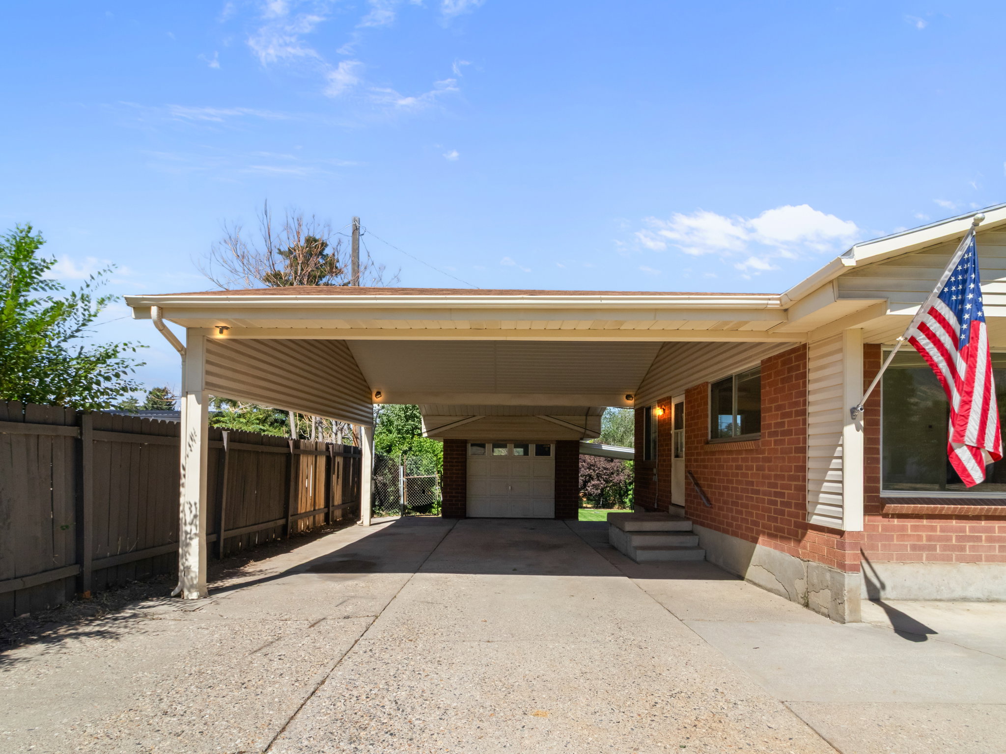Covered carport providing sheltered parking