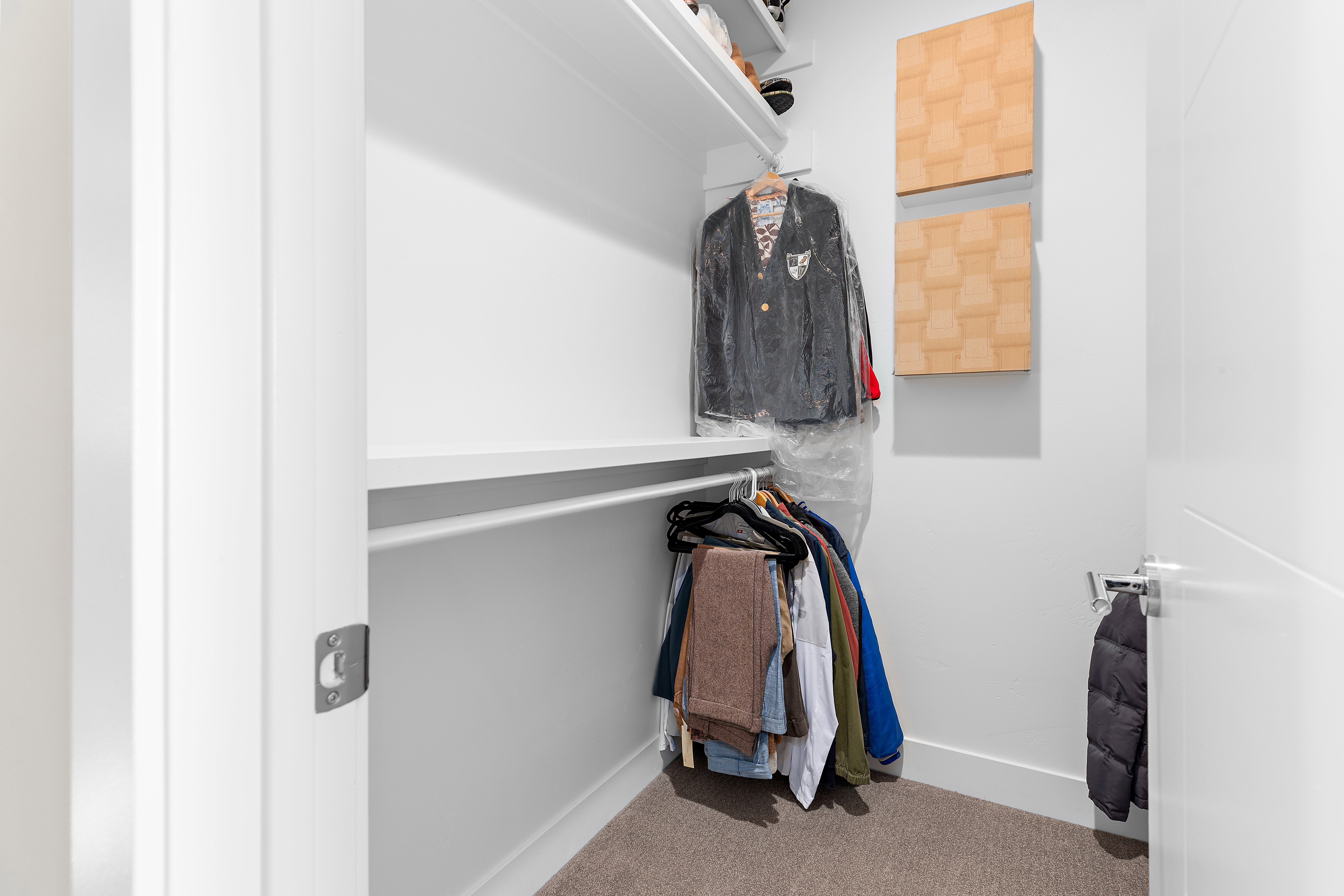 Custom closet system featuring a hanging rod and integrated shelving