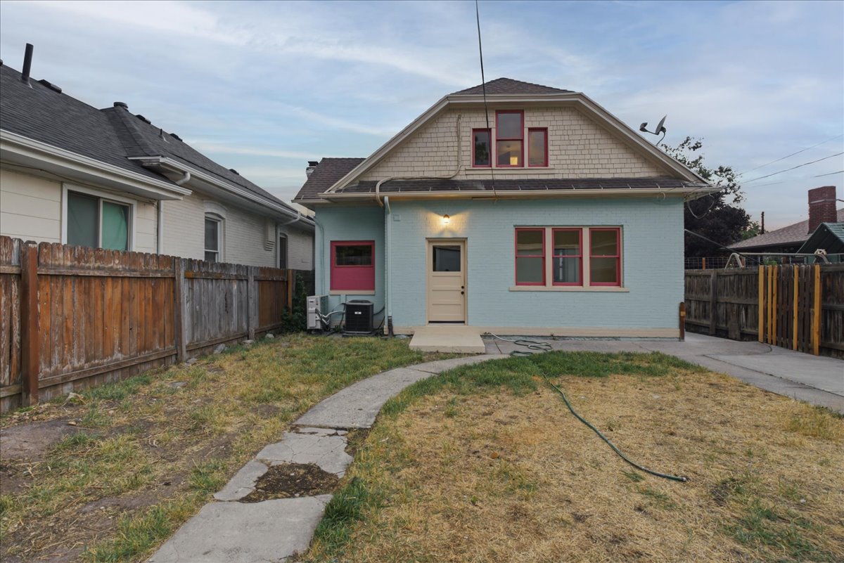 Light blue exterior with contrasting red window frames