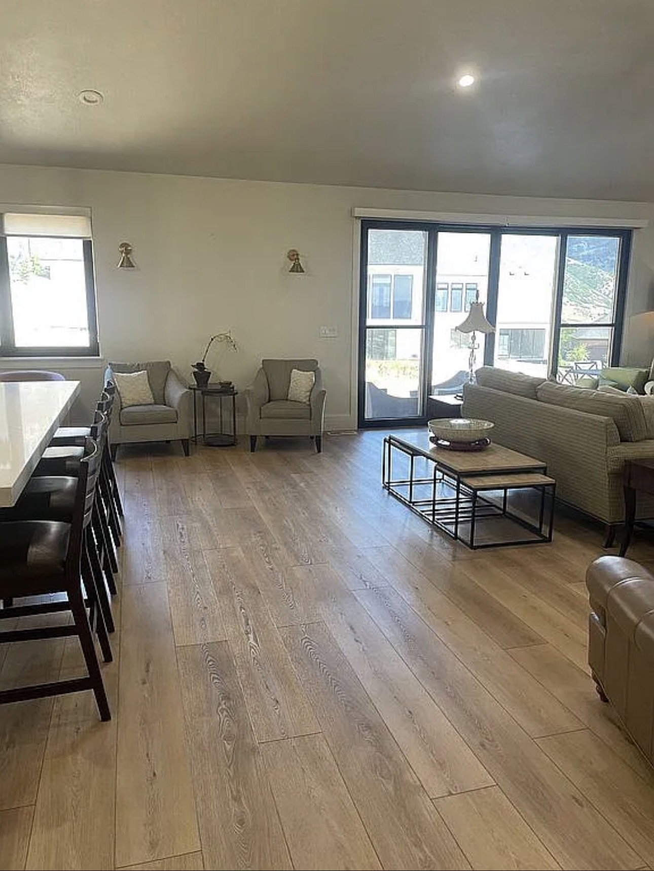 Spacious room featuring light wood-finish flooring, recessed lighting, and a white ceiling