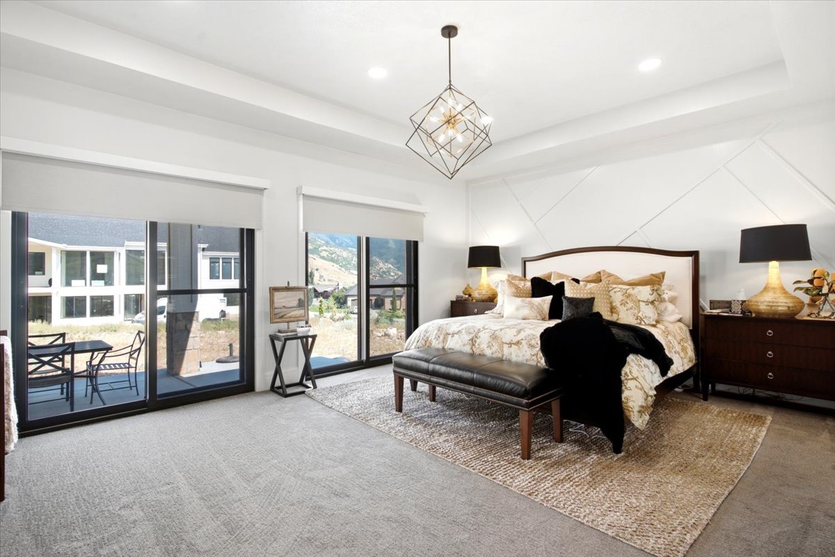 Spacious room featuring a decorative accent wall, recessed lighting, and a contemporary chandelier