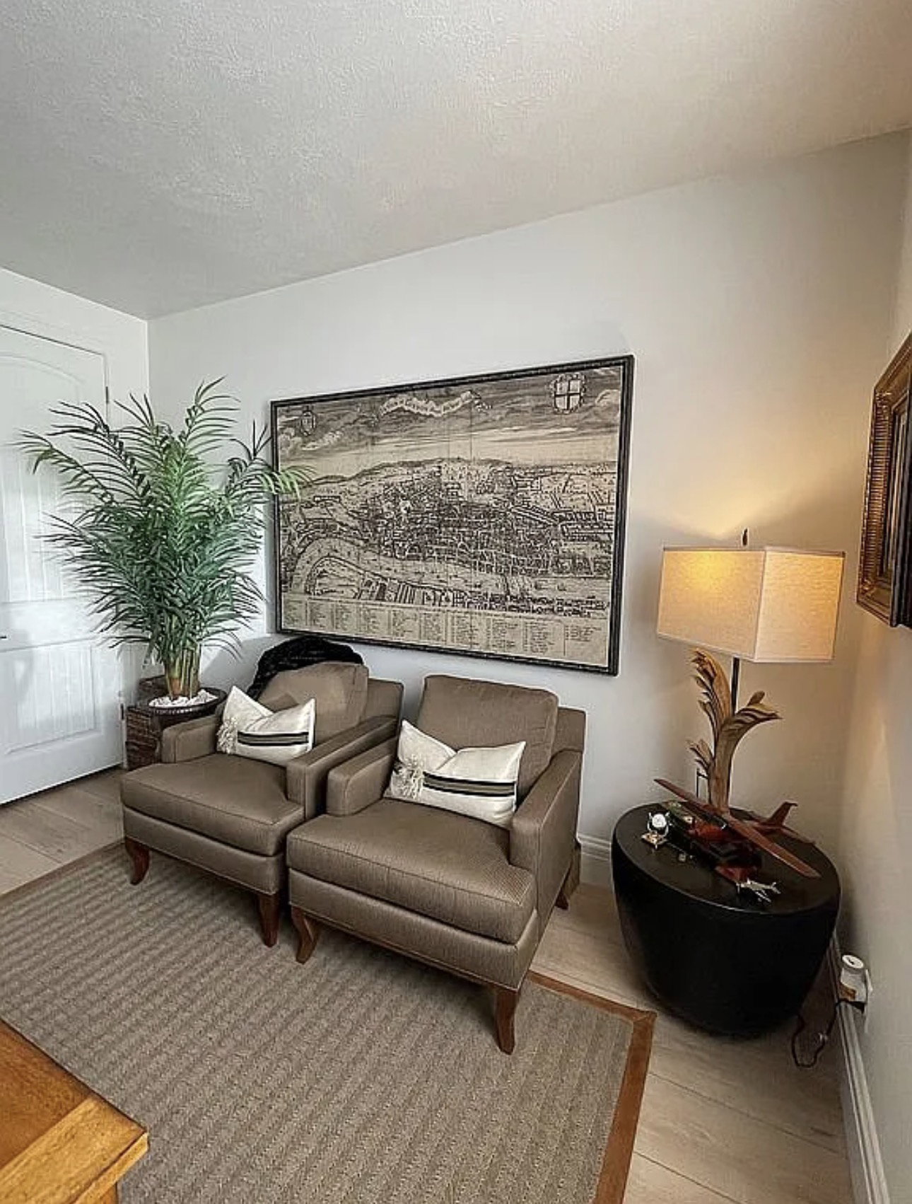Wood-finish flooring complemented by a textured area rug